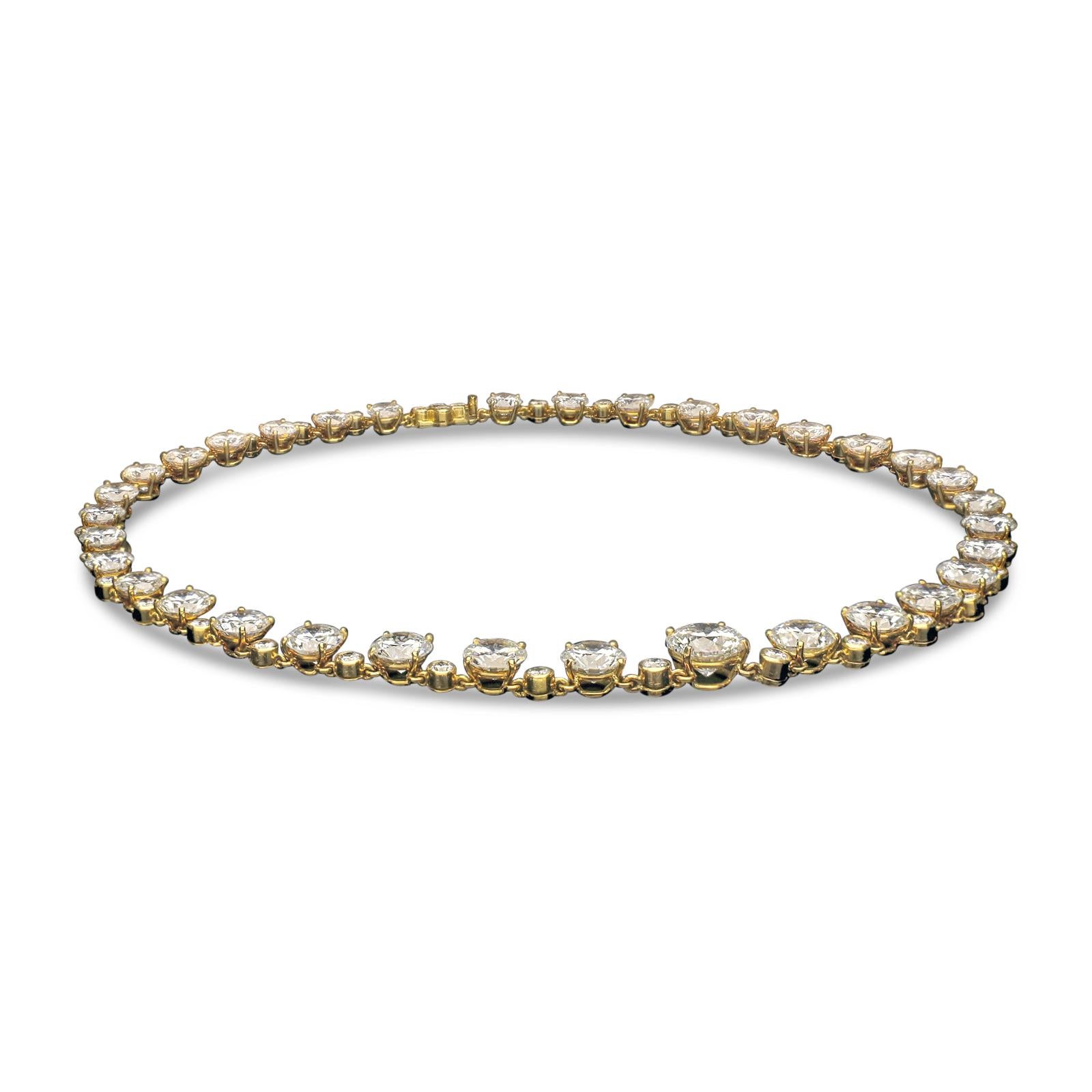 A stunning diamond riviere necklace by Asprey & Co. 1962, composed of thirty four round brilliant cut diamonds ranging from 0.61ct to 3.01ct and weighing a combined total of 37.79cts and of D-H colour and VVS1-SI1 clarity, in claw settings and