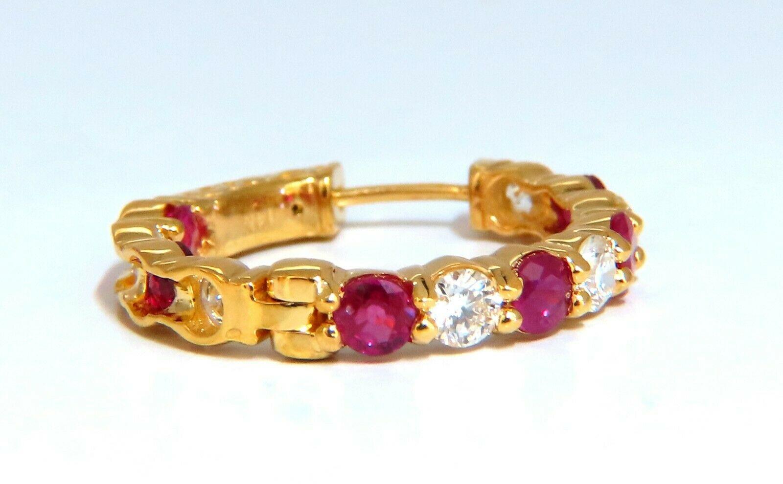 Inside/out  natural Ruby and Diamond hoop earrings.

2.50ct. round rubies, full brilliant cut clean clarity and transparent

1.64ct. natural round diamonds i color vs2 clarity.

14 karat yellow gold 7.3 g

23 mm wide (front to back)

3.6 mm wide at