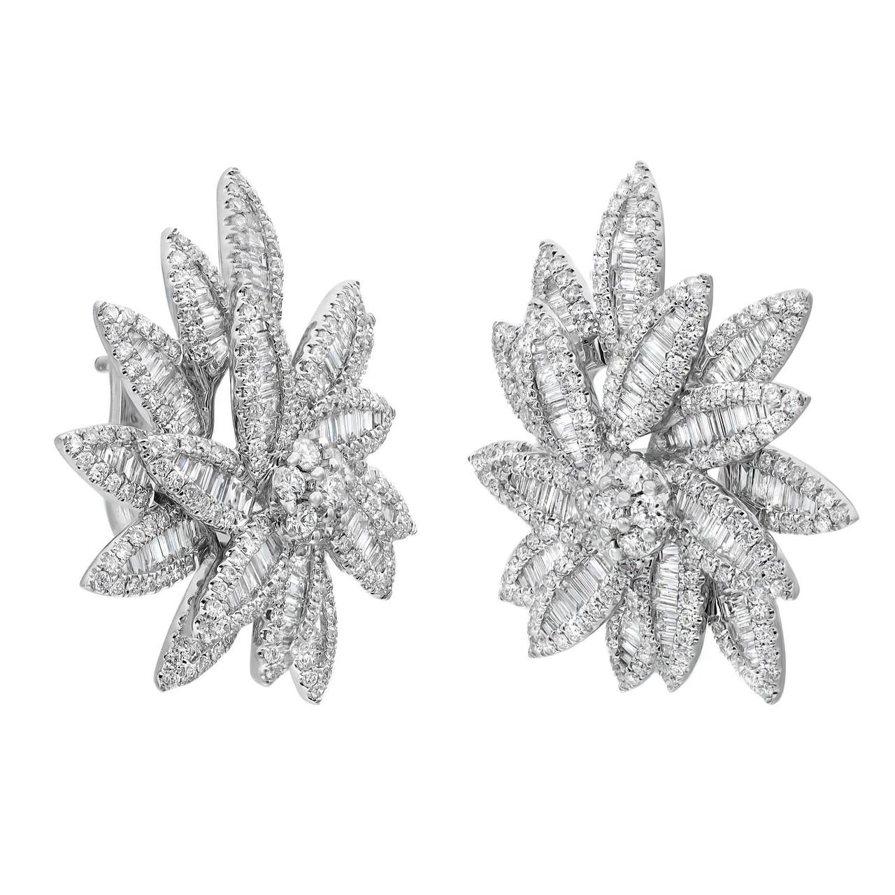 Elevate your look with these stunning diamond large stud earrings, designed to dazzle and delight. Expertly crafted from opulent 18K white gold, they boast a mesmerizing arrangement of channel set baguette cut diamonds, forming elegant flower petals