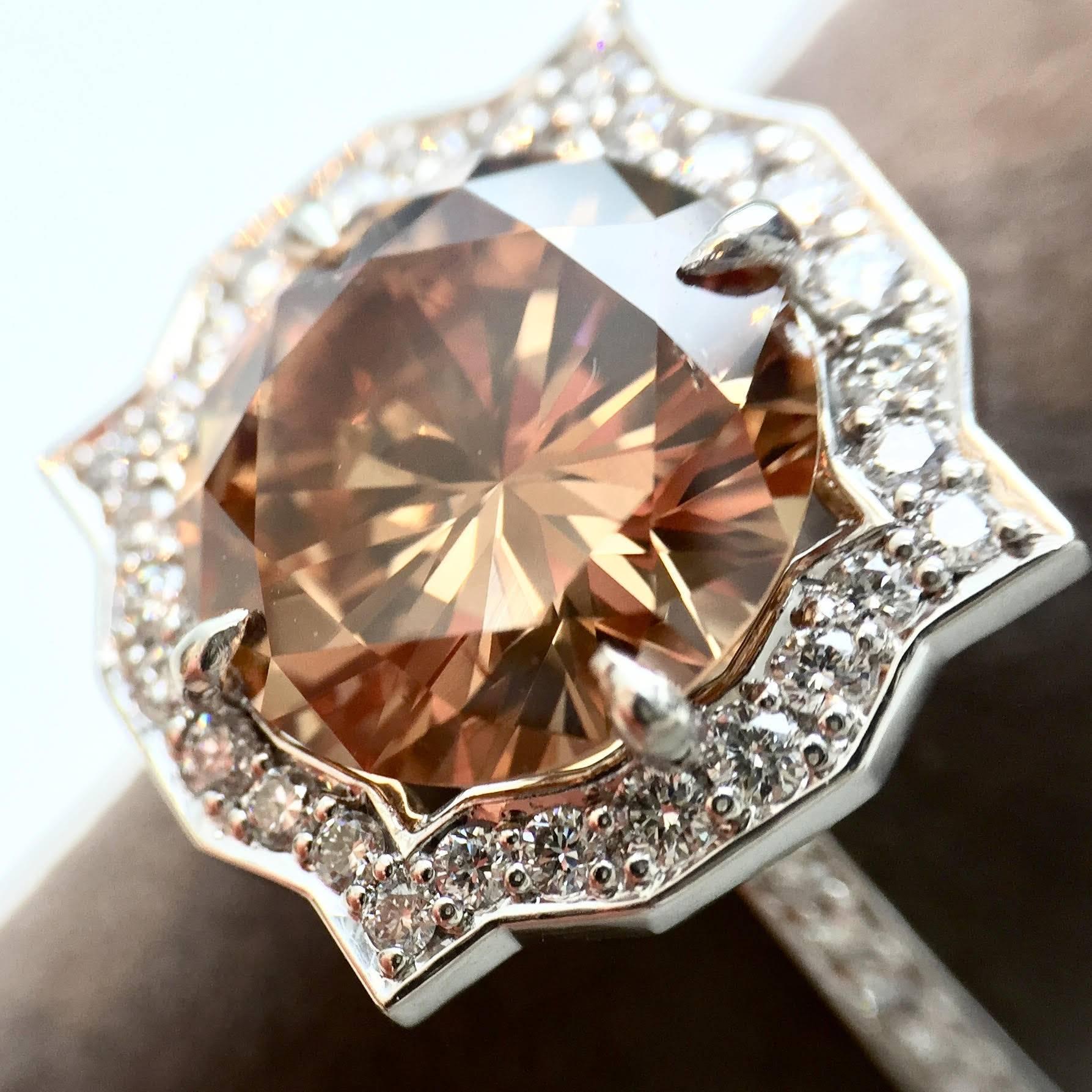 Vivid and lively E.G.L. USA certified 4.15 carat genuine fancy orangy brown diamond set in a stylish Art Deco inspired platinum halo mounting. This round brilliant untreated fancy orangy brown diamond reflects a range of beautiful colors. See image