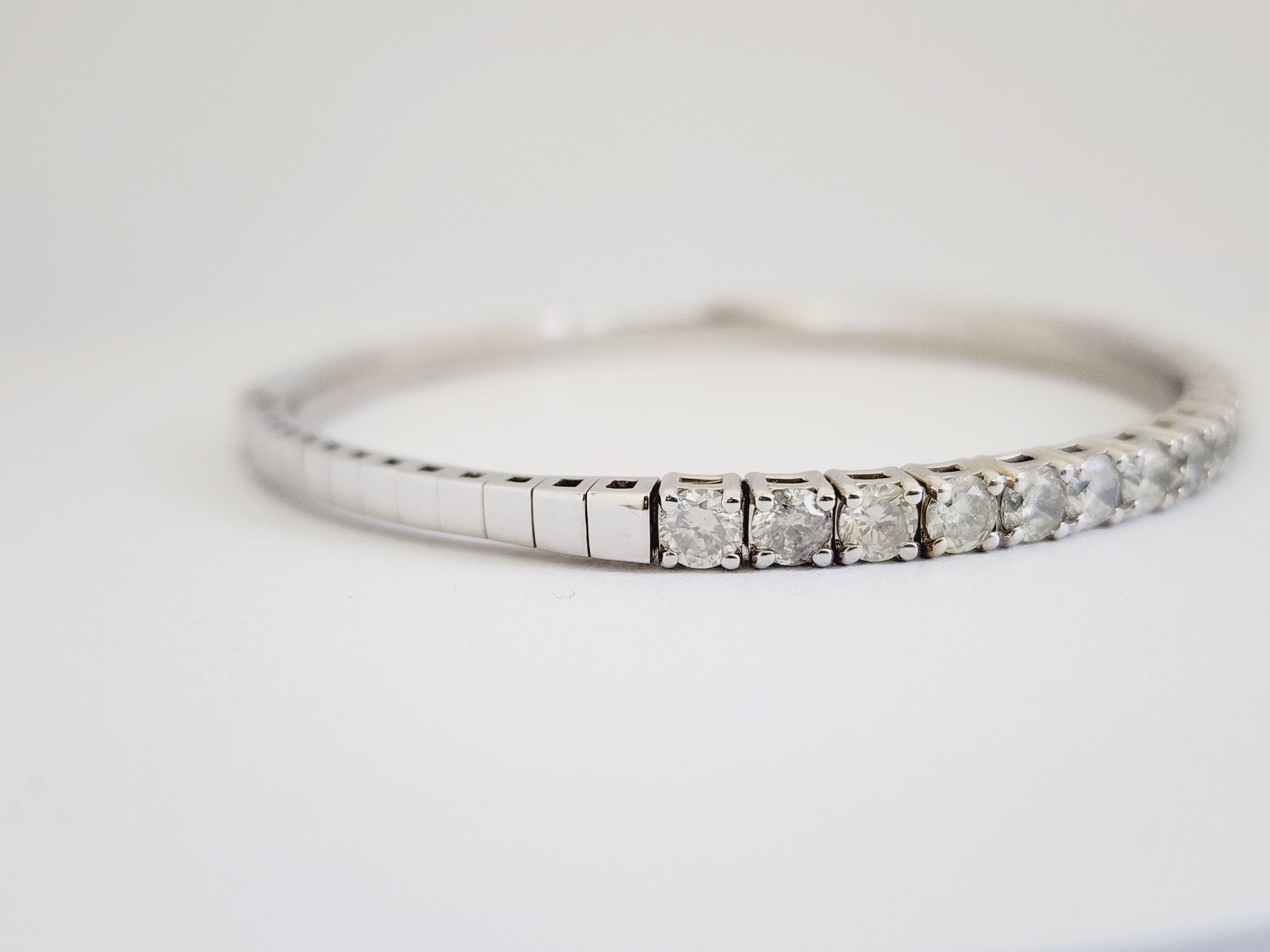 Natural Diamonds 4.15 ctw flexible half way around bangle white gold 14k 7 Inch. Average Color H Clarity I, 3.7 mm wide.