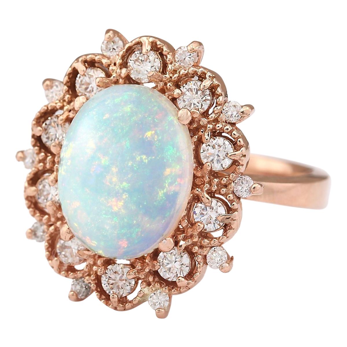 Stamped: 14K Rose Gold
Total Ring Weight: 8.1 Grams
Total Natural Opal Weight is 3.40 Carat (Measures: 13.00x10.00 mm)
Color: Multicolor
Total Natural Diamond Weight is 0.75 Carat
Color: F-G, Clarity: VS2-SI1
Face Measures: 21.10x20.15 mm
Sku: