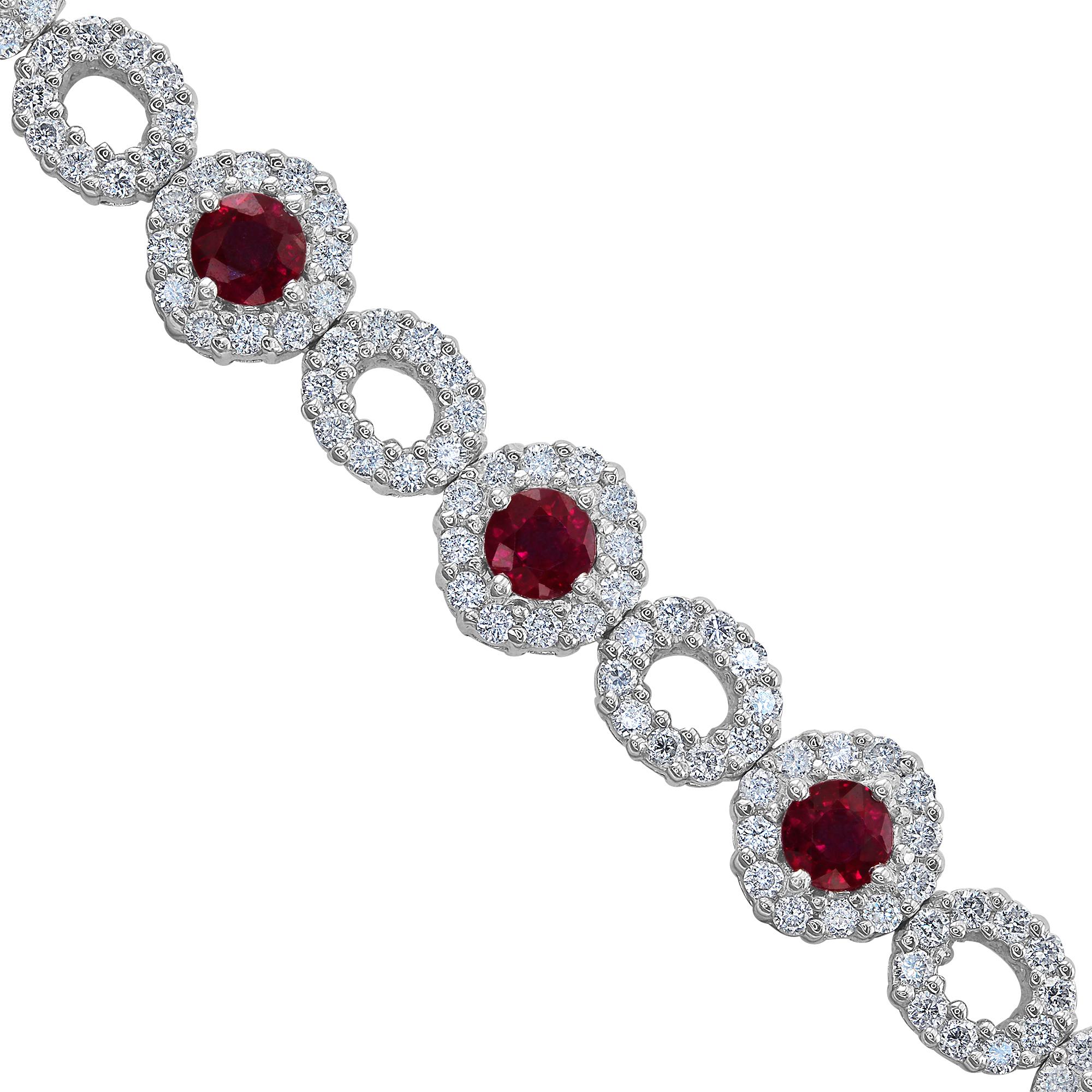 This bracelet features 12 round rubies, set in white gold, with a single diamond halo. Each ruby alternates with a set of 10 round diamonds that create an oval shape. There are a total of 264 diamonds, 2.88 carat total weight.

This gorgeous one of