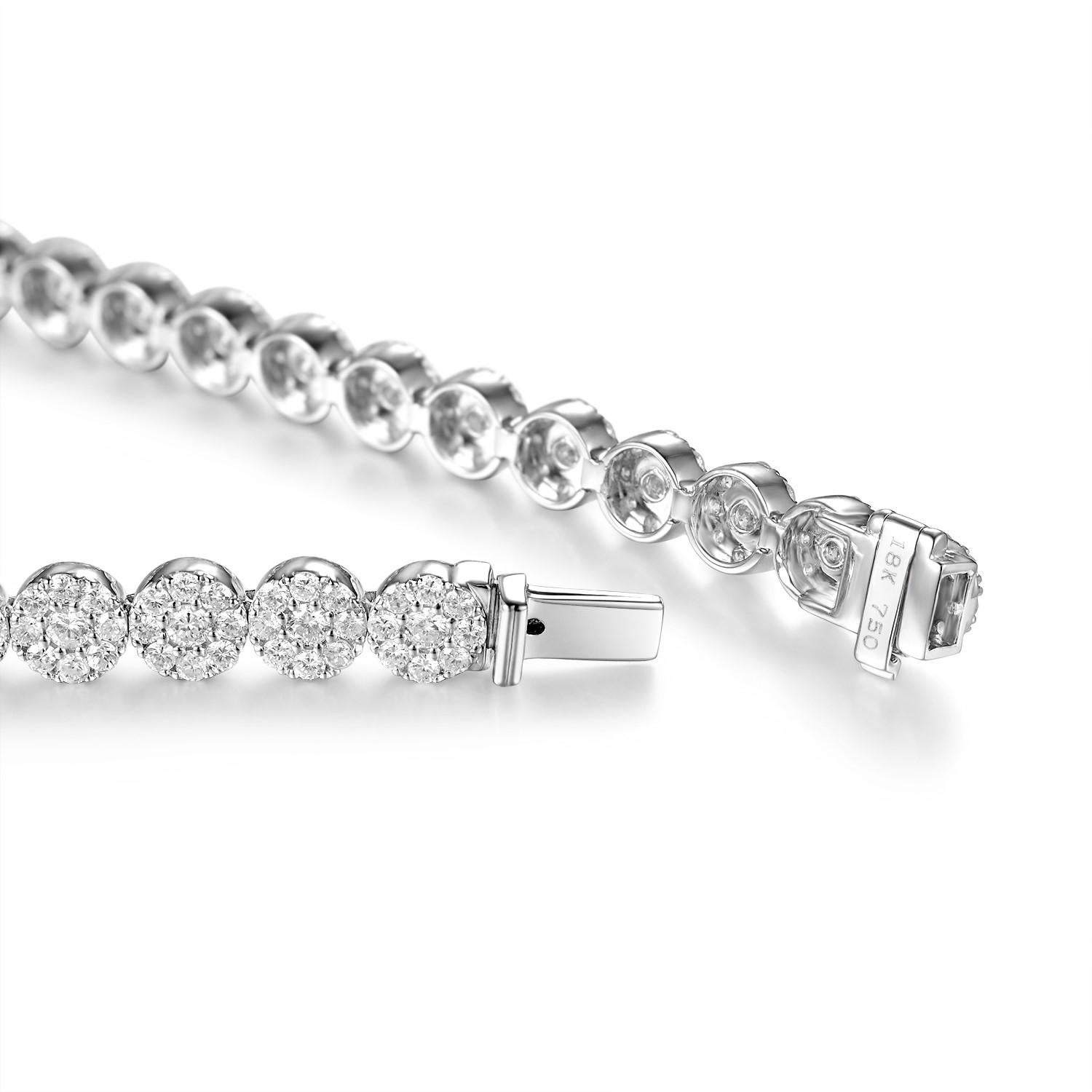 This tennis bracelet feature 4.15 carat of white round diamonds. Each section is set with 1 in 6 cluster diamonds. The color of the diamonds are F-G color and SI clarity. 

Length 18cm
Complimentary length adjustment 