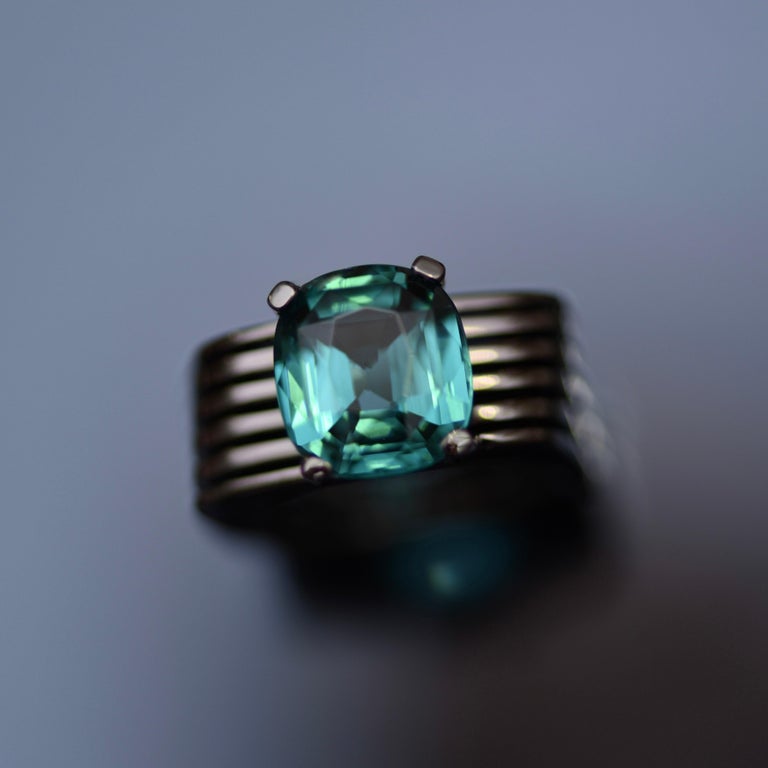 One of a kind ring with beautiful tourmaline indigolite lagoon color from limited Jewellery Kinetics Collection by D&A. 
Inspired by the iconic kinetic sculpture of Breakfastny, we captures the essence of 