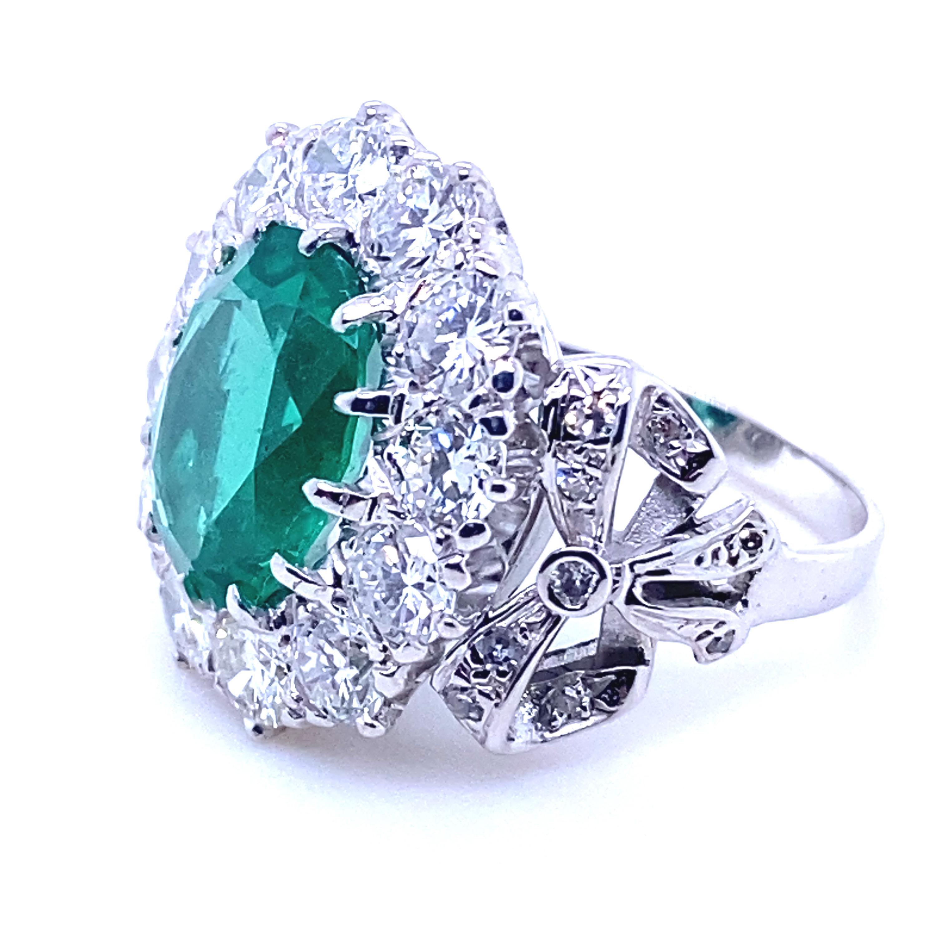 Retro 4.15 Carat Zambian Emerald and Diamond Cluster 18 Kt White Gold Engagement Ring For Sale