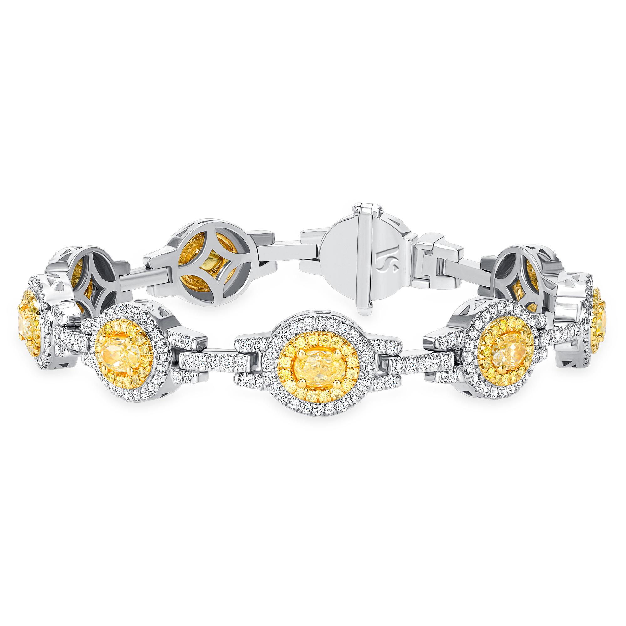 4.15 ct Fancy Yellow Oval Diamond 14k Gold Bracelet/One of a Kind Jewelry 

Symbolize your limitless nature with this stargaze bracelet. This High-end two-tone diamond bracelet features oval cut shapes diamond in the middle and surrounded by some