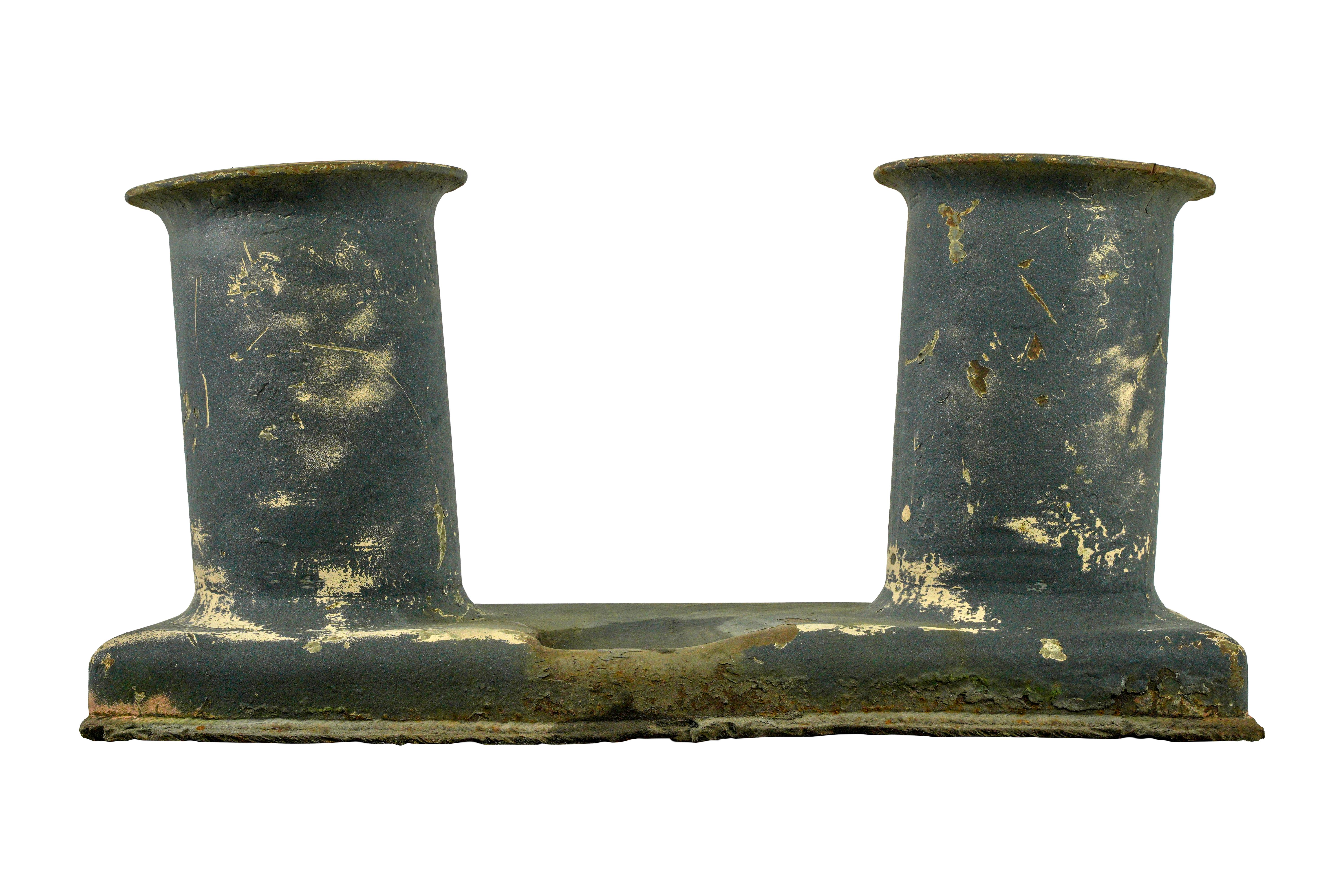 The cast iron construction adds a rustic and weathered charm, reminiscent of its original use on ships. The distressed paint further enhances the vintage appeal, telling a story of its exposure to the elements over time. Install this mooring bollard