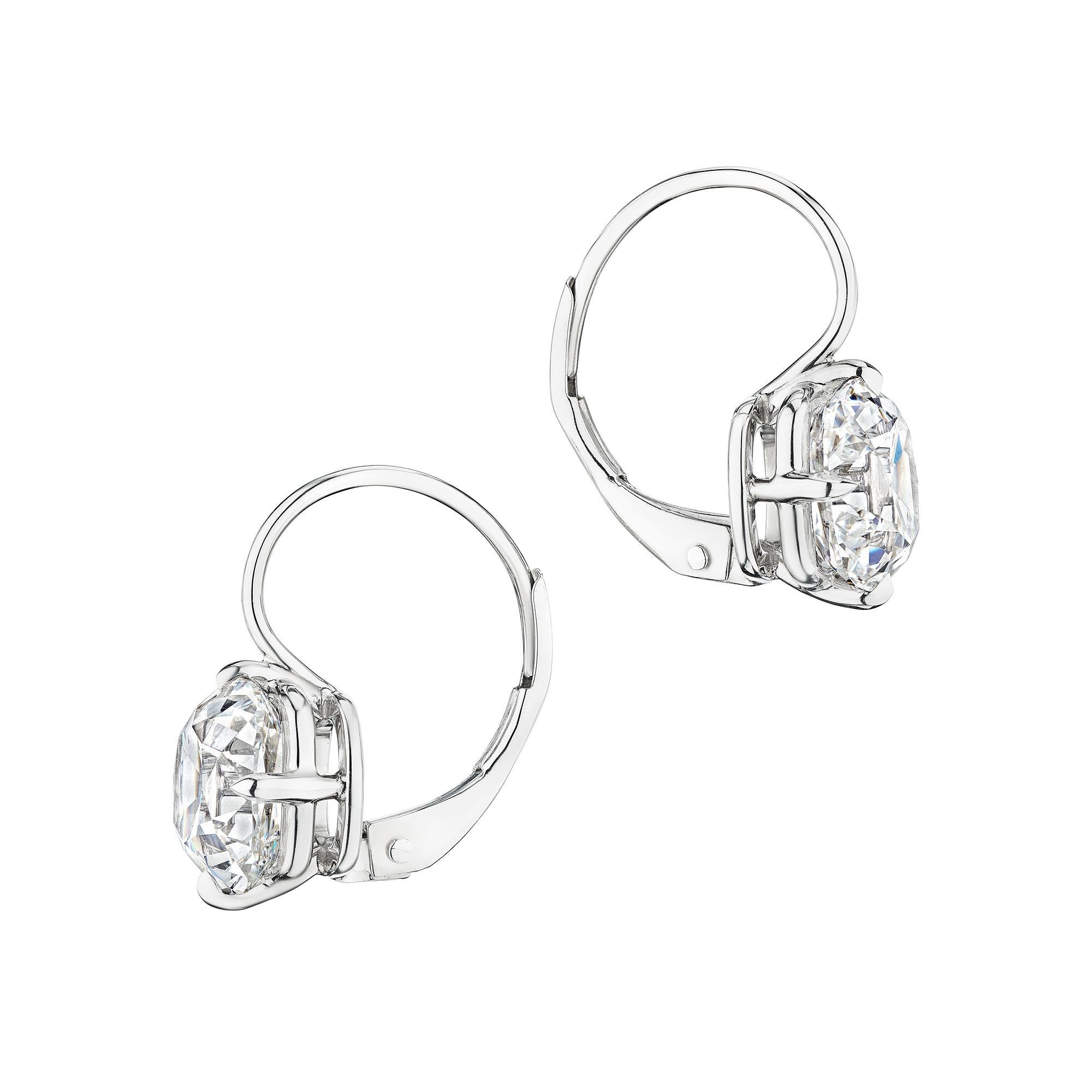 With modern and graphic lines, these 4.15 carat vintage cushion brilliant cut diamond platinum earrings are 24/7 chic. Diamond color F. Clarity VS1-2. GIA certified #5231056789 and #5234056649. Designed by Steven Fox Jewelry. Lever backs. 5/8