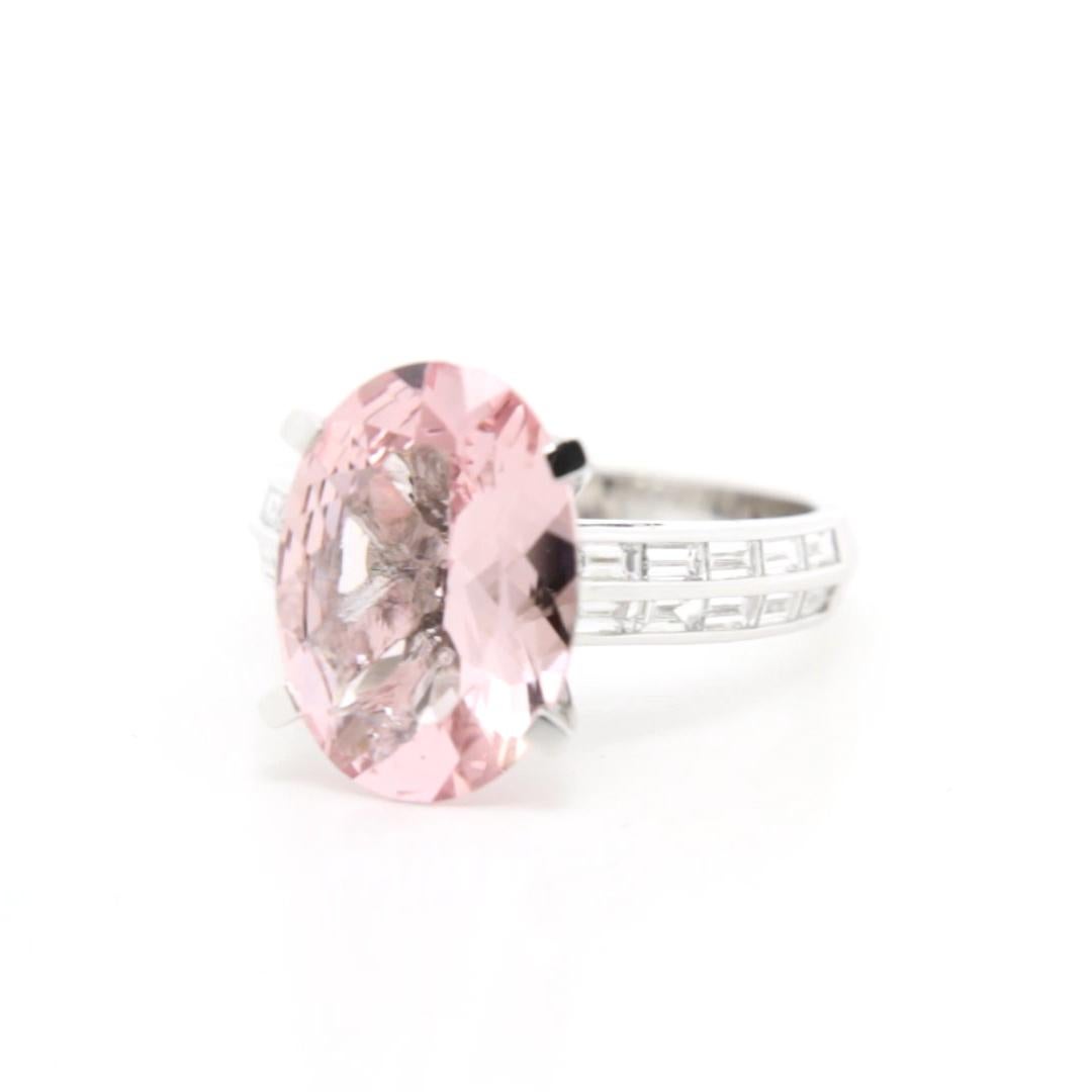 Refined Brilliance: The Pink Morganite Baguette Diamond Ring

This elegant ring is a beautiful blend of subtle sophistication and modern design, showcasing a mesmerizing 4.150-carat pink morganite as its centrepiece. The morganite’s soft blush tones