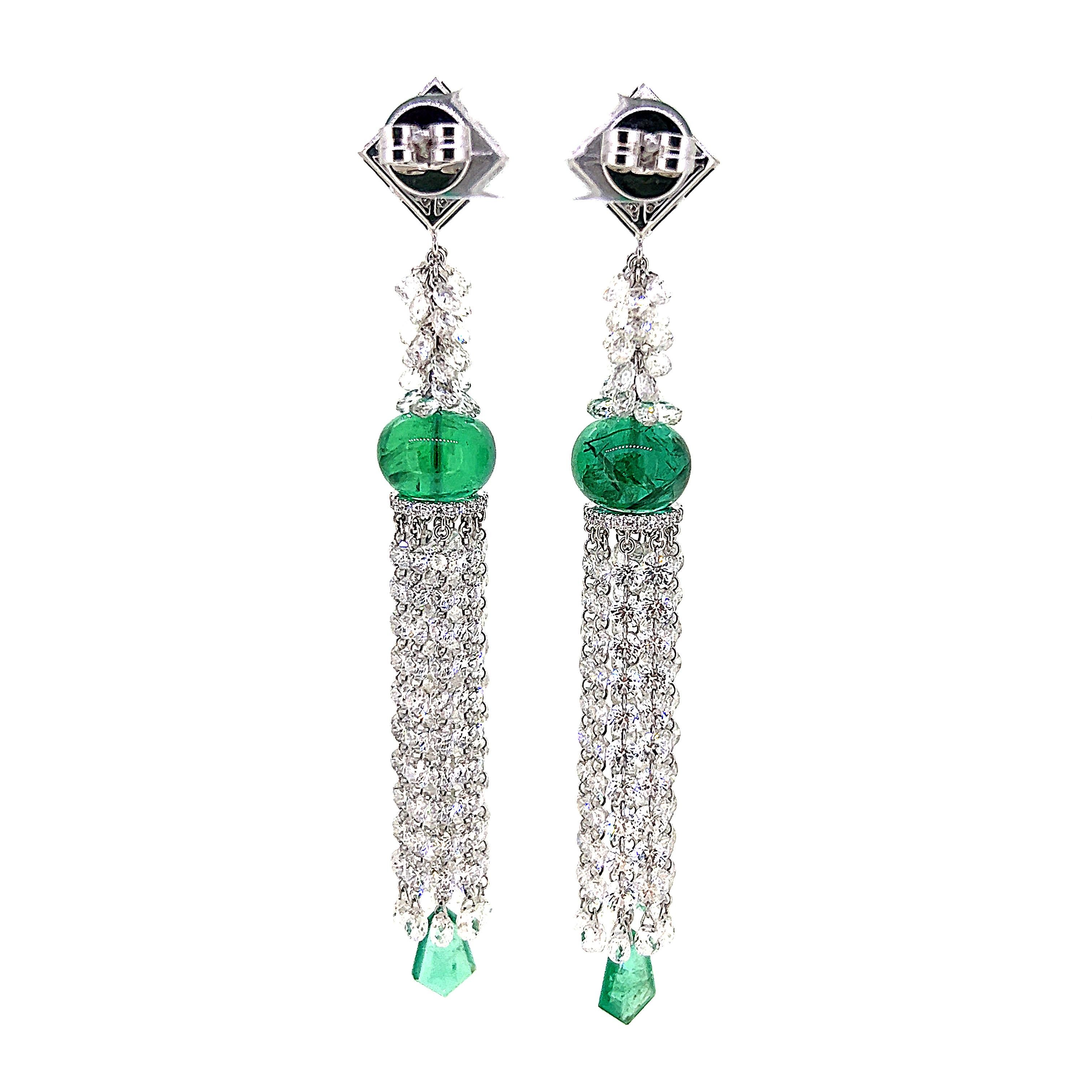 This one-of-a-kind vintage style Tassel Earrings which features 3 pairs of stunning Emerald of various cut.  The eye-catching Tassel features bright Round Brilliant cut Diamonds and Briolette Diamonds weighing 25.75 carats.  This pair of earrings is