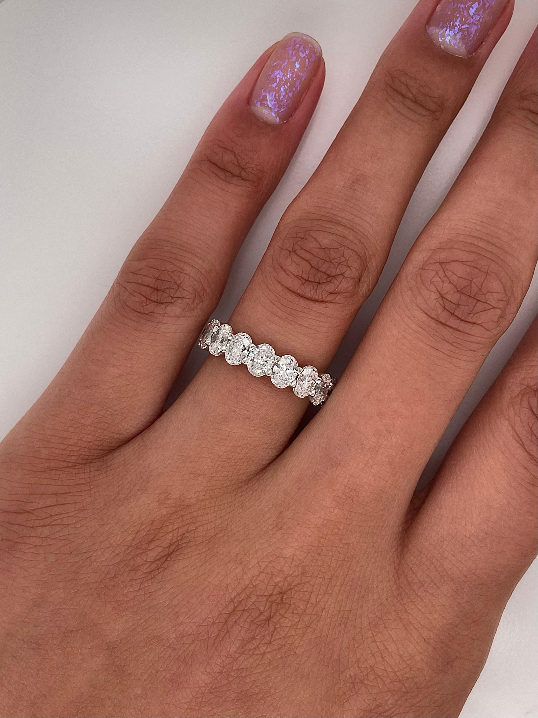 Ladies diamond Eternity band carries a total of 4.15ct of oval cut diamonds placed in platinum.

Size: 6.0
Color: G
Clarity: VS1

This shared prong style Eternity band was handmade by our jewelers in New York City.