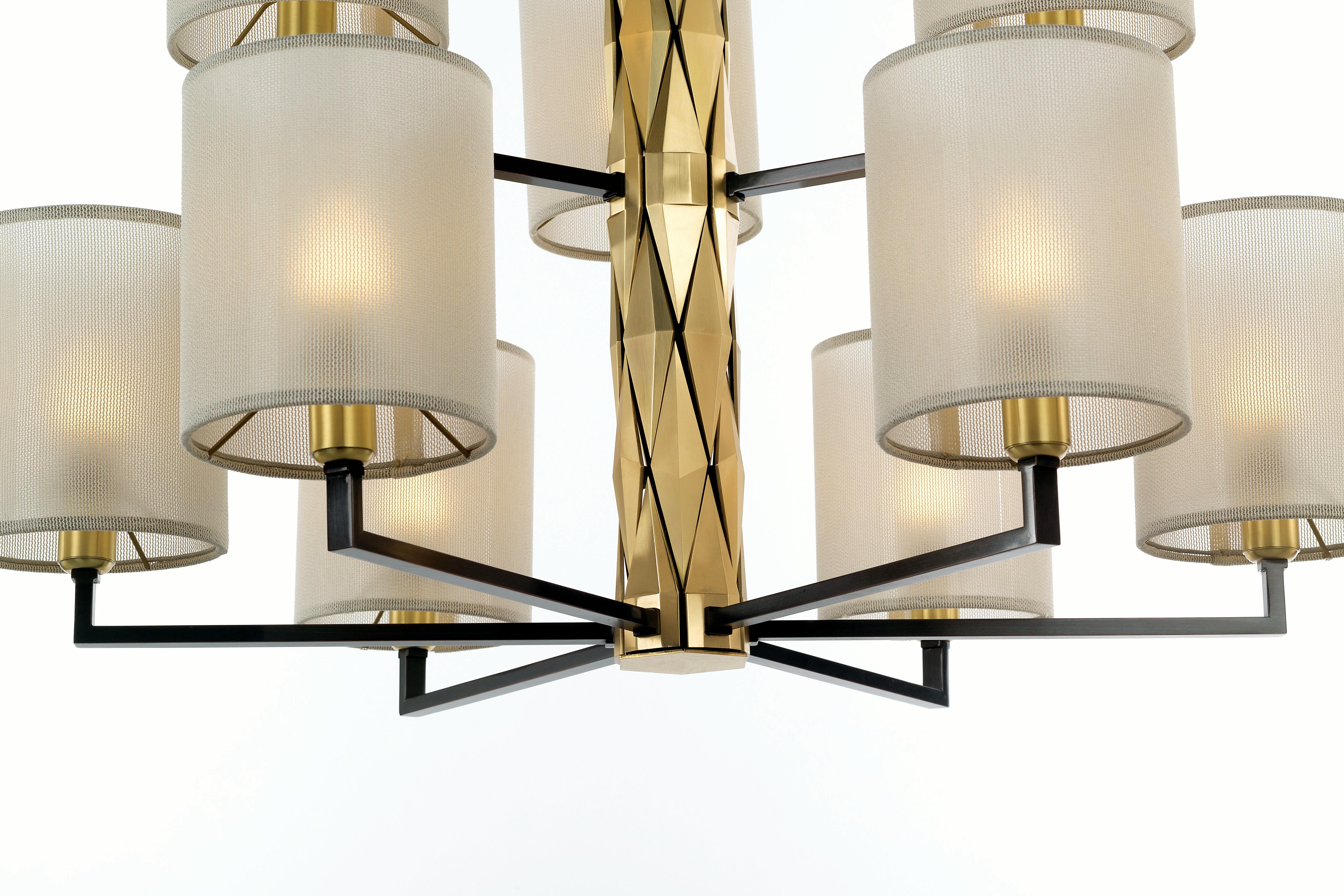 Flaire Collection - Rich central body composed of many solid brass elements, bevelled in various ways for an array of facets.

Central structure and detailing in solid natural brass; lamp holders, base and inner structure in burnished copper