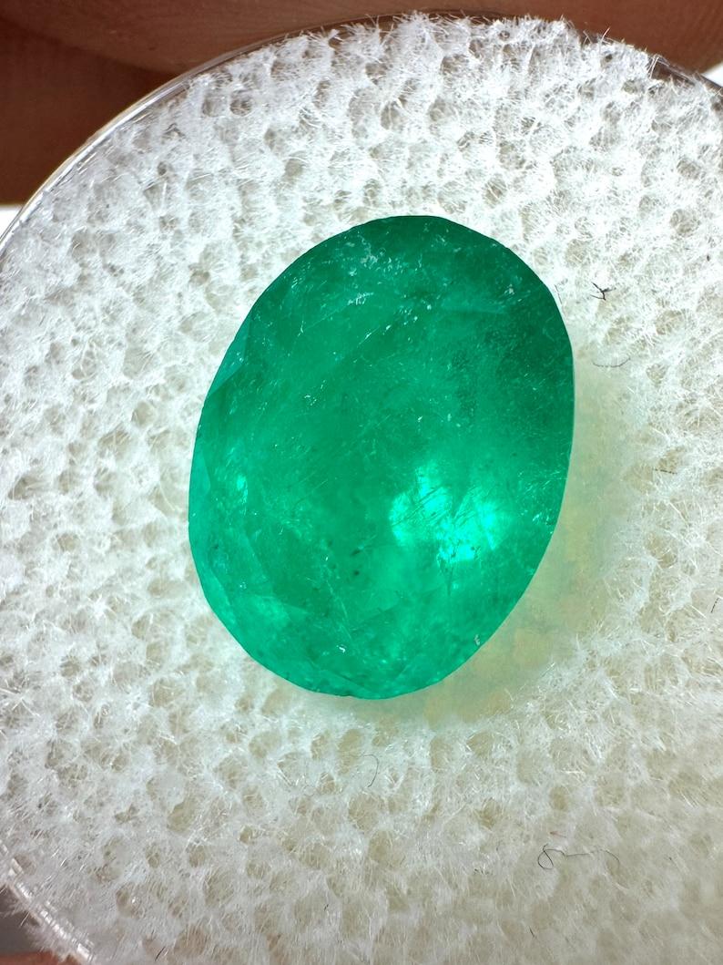 Stone: Emerald
Weight: 4.16-carats
Shape: Oval Cut
Clarity: Semi-Transparent
Luster: Good
Color: Rich Green
Measurements: 11.70mm x 8.91mm x 6.62mm
Geographic Origin: Colombia
Treatment: Natural, Oiling

Comments: Due to their growth conditions in