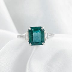 Exceptional 4.16-Carat Emerald-Cut Emerald and Diamond Three-Stone Ring