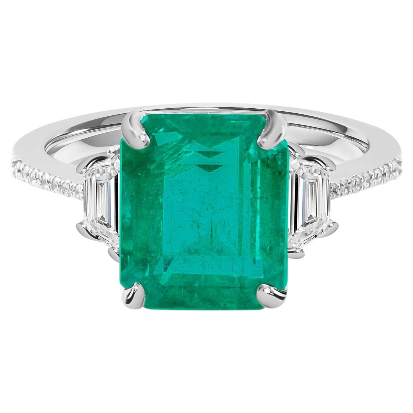 Exceptional 4.16-Carat Emerald-Cut Emerald and Diamond Three-Stone Ring