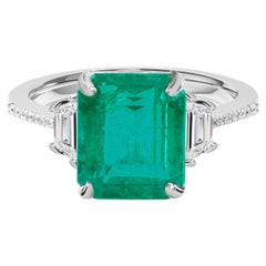 Exceptional 4.16-Carat Emerald-Cut Emerald and Diamond Three-Stone Ring