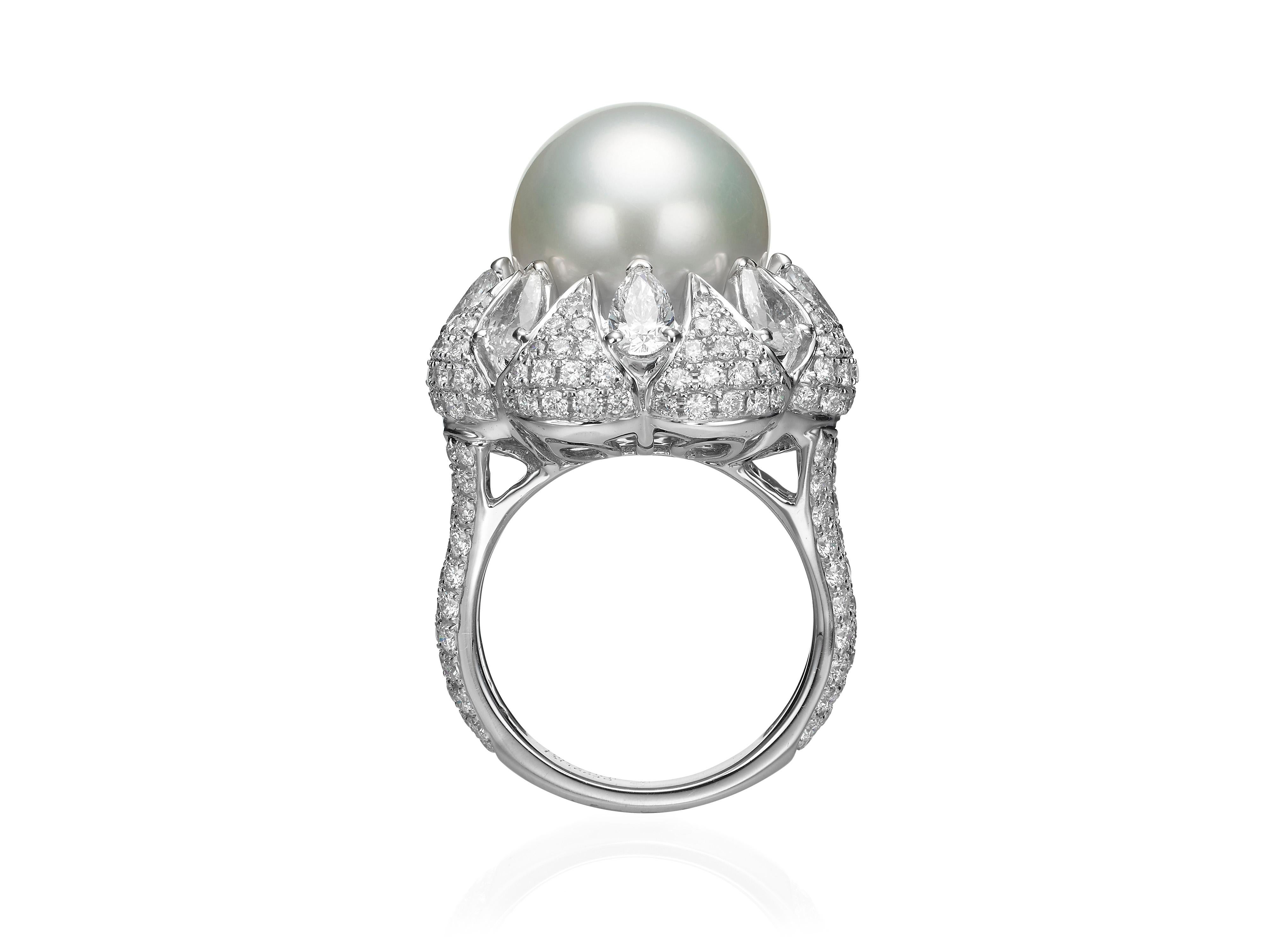 Butani's Diamond and South Sea Pearl Cocktail Ring features a floral inspired silhouette with a 13.5mm South Sea Pearl at the center and 4.17 carats of glistening brilliant-cut and pear-cut white diamonds.  Set in 18K white gold.  Currently a ring