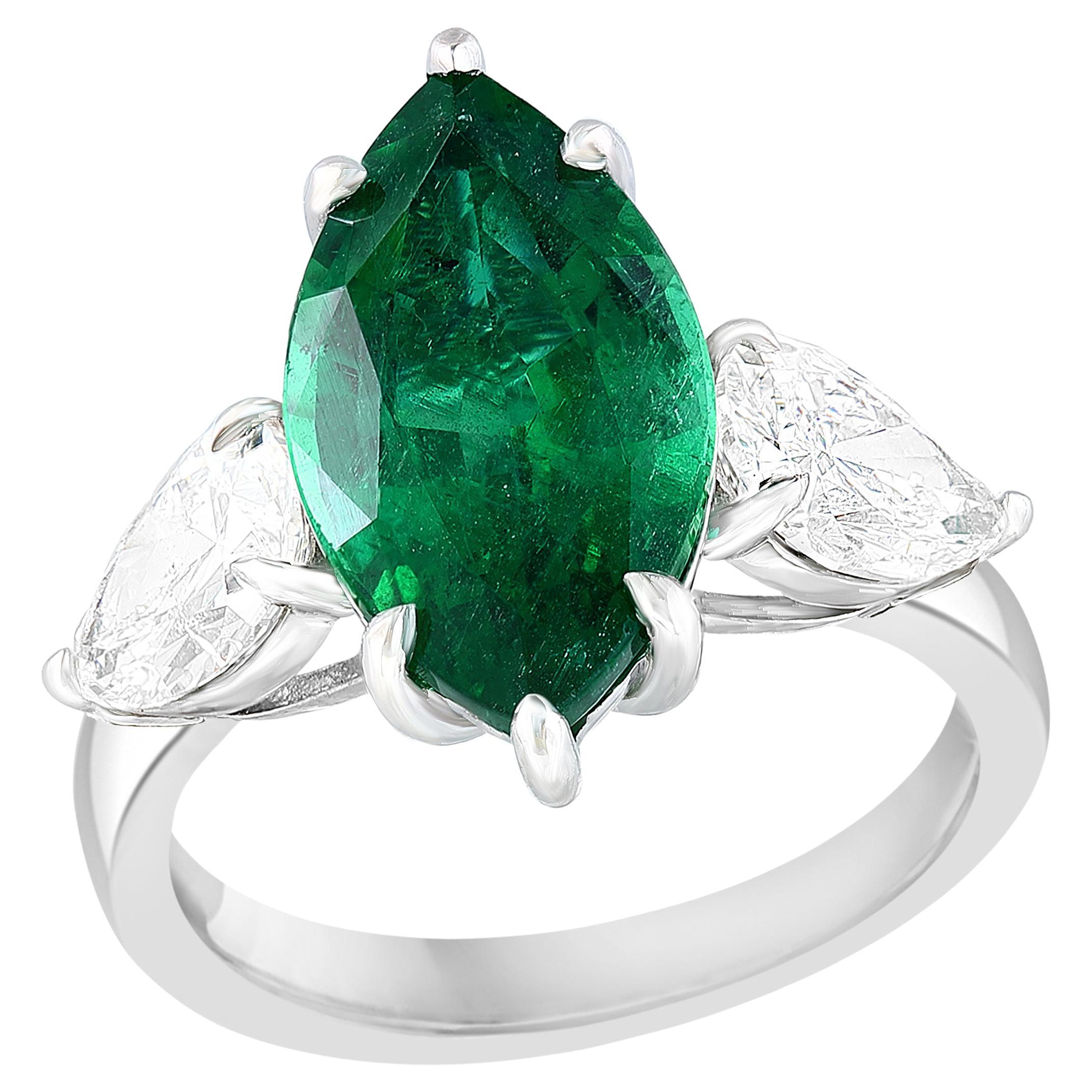4.17 Carat Marquise Shape Emerald and Diamond 3 Stone Ring in Platinum For Sale