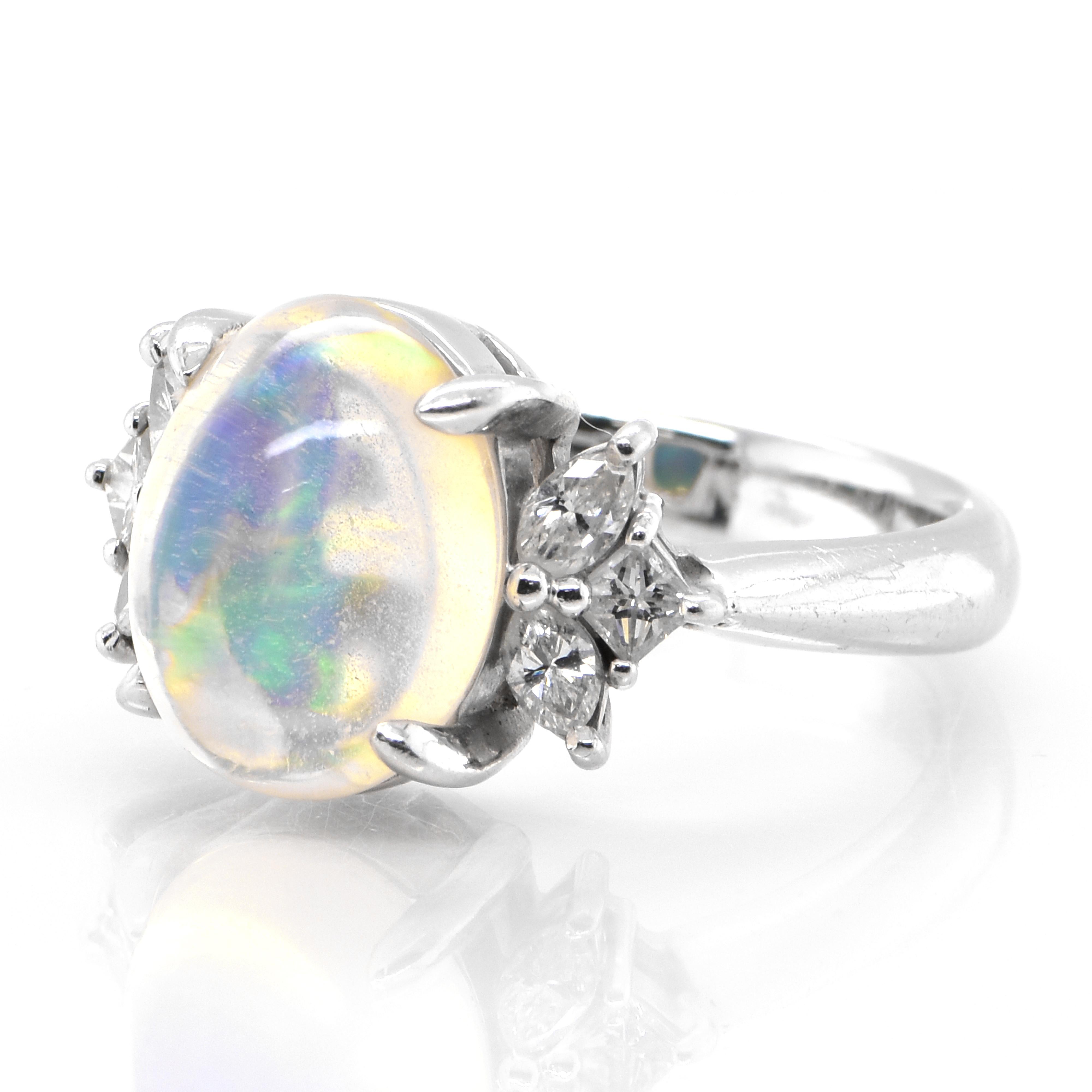 A beautiful ring featuring a 4.17 Carat Natural Water Opal and 0.45 Carats of Diamond Accents set in Platinum. Opals are known for exhibiting flashes of rainbow colors known as 