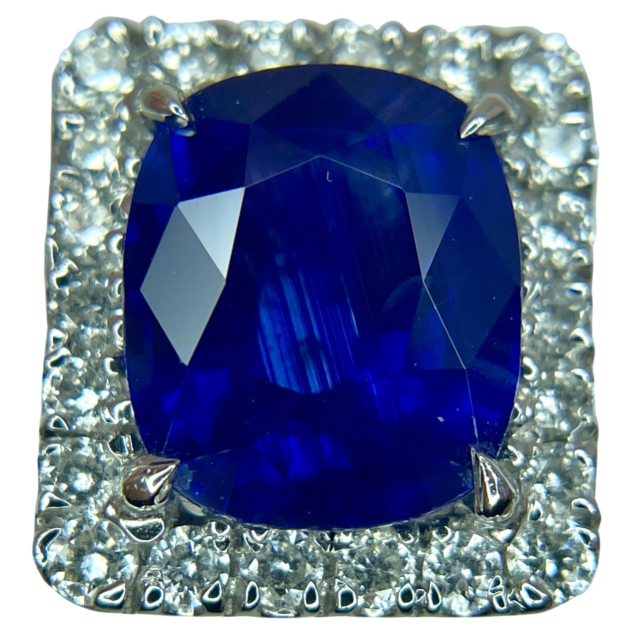 This is a GORGEOUS blue sapphire mined in Sri Lanka. It is fully saturated. This sapphire has a beautiful blue and mounted in a detailed and 18K white gold ring with 0.93 carats of brilliant white diamonds.
