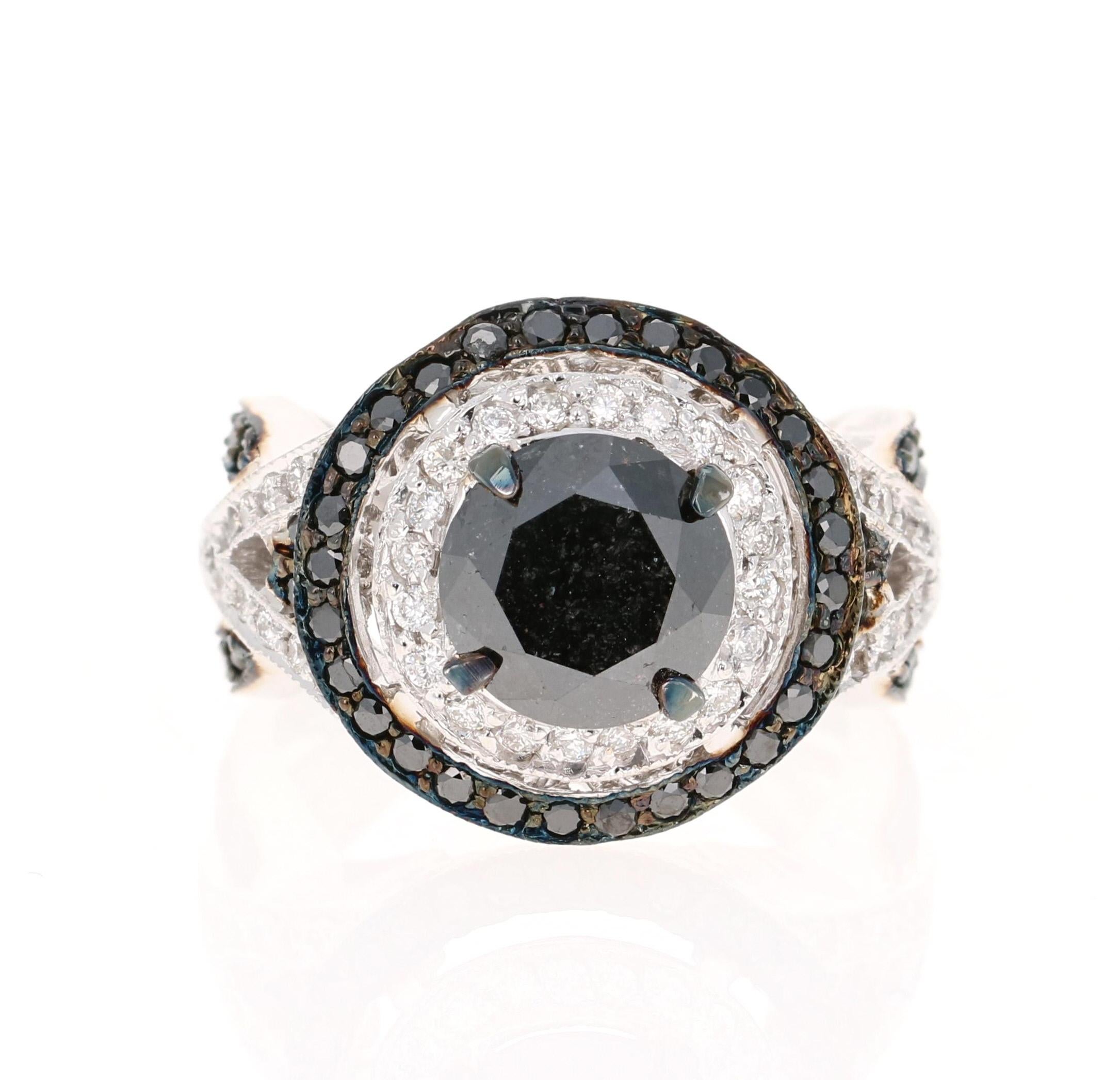 Gorgeous Black Diamond ring that can transform into an Engagement ring.  

There is a 2.72 Carat Round Cut Black Diamond in the center on the ring which is surrounded by 46 White Round Cut Diamonds that weigh 0.51 Carats and 72 Black Round Cut