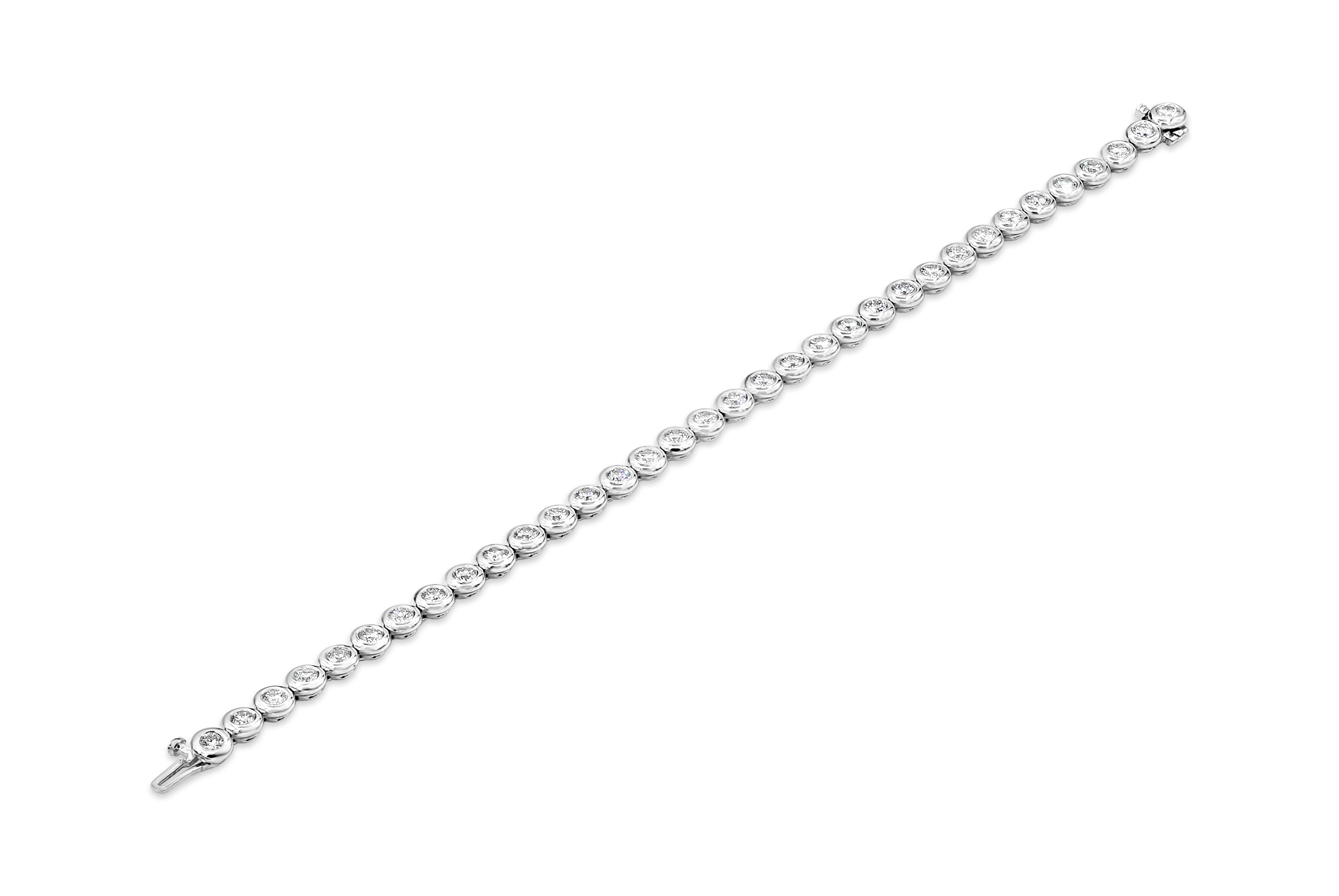 A versatile and timeless tennis bracelet showcasing a row of round brilliant diamonds weighing 4.17 carats total, G Color and VS-Si in Clarity. Bezel set, Made with 14K White Gold, 7 inches in Length.
Style available in different price ranges.