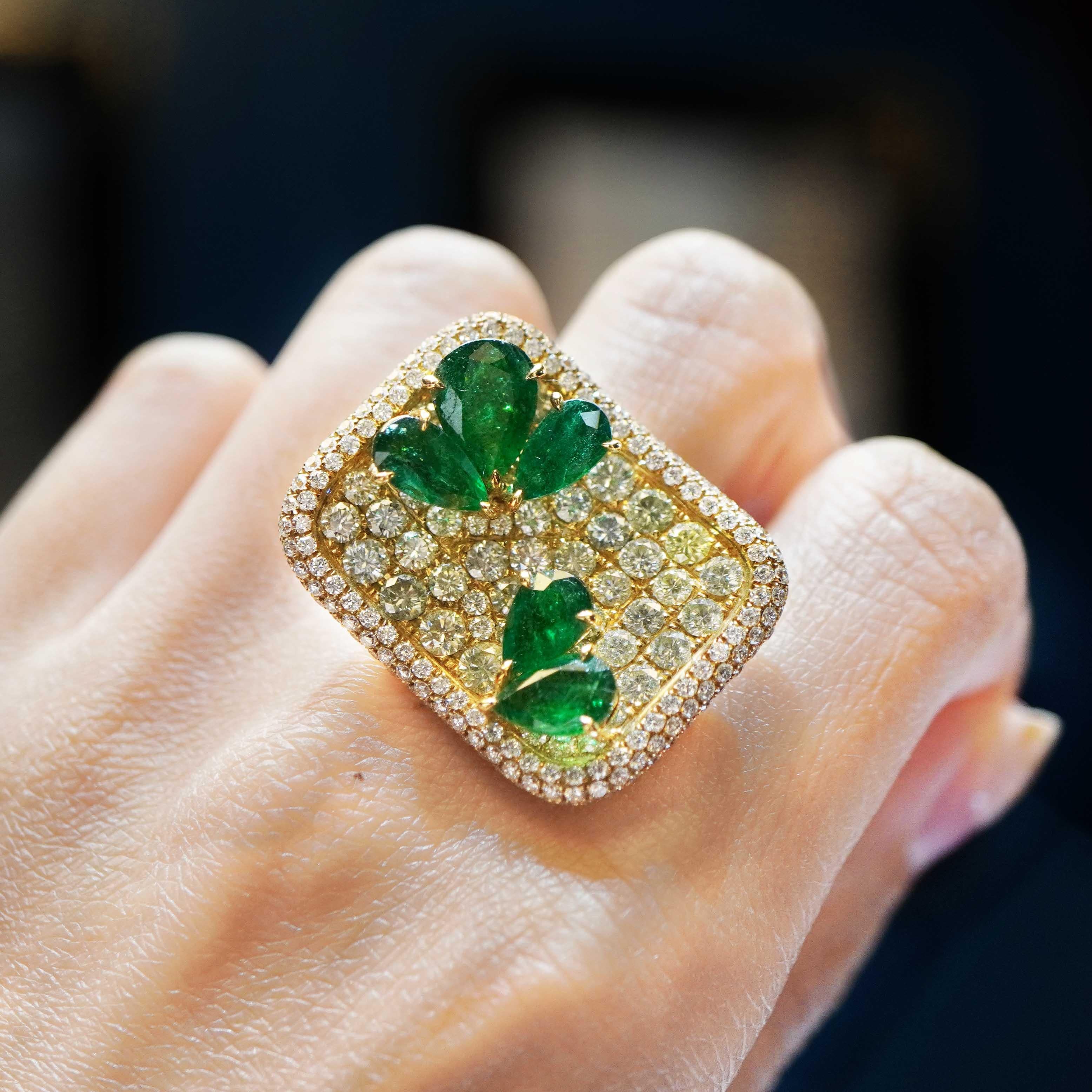 4.17 carat of vivid green Colombian emerald are set along with 4.33 carat of natural fancy color diamond in this Garden Inspired ring. The ring is a spectacular combination of vivid green emerald and mix color natural fancy color round brilliant