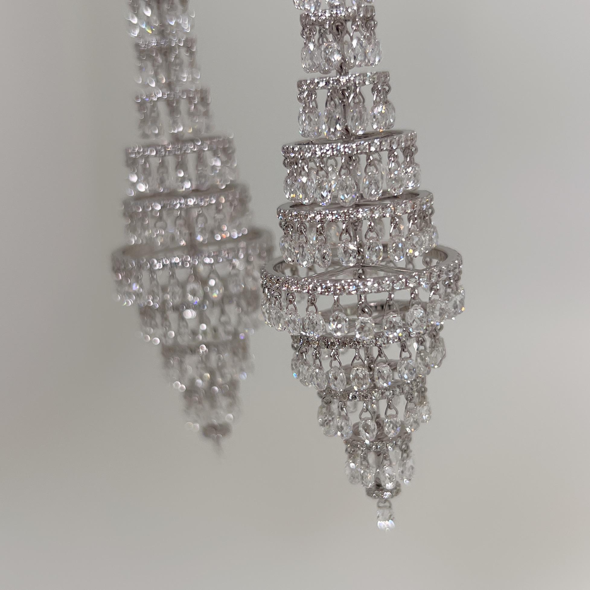 This is a stunning 1920 inspired Dangling Diamond Earrings weighing 41.70 carats in total.  This remarkable piece features 1016 pieces of Briolette cut and Round Brilliant cut diamonds set on 18 Karat White Gold. 

Diamond: 41.70 carats
Dimension: 