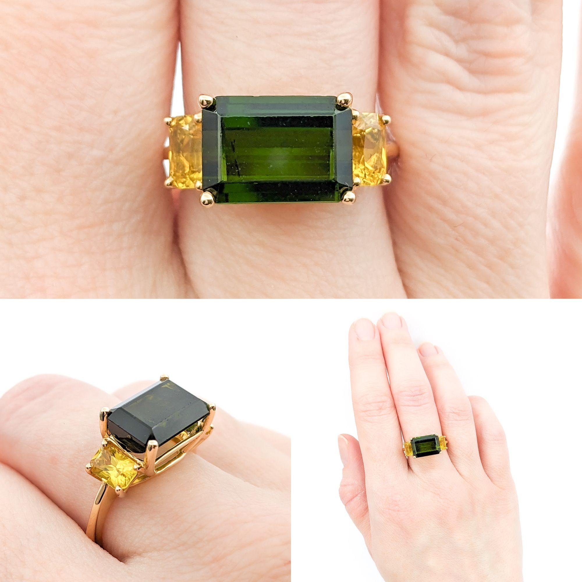 4.17ct Green Tourmaline & 1.44ctw Yellow Sapphires Ring In Yellow Gold

This exquisite ring, fashioned from 14kt yellow gold, showcases a magnificent 4.71ct tourmaline as its centerpiece. This gemstone, known for its vibrant color and clarity, is