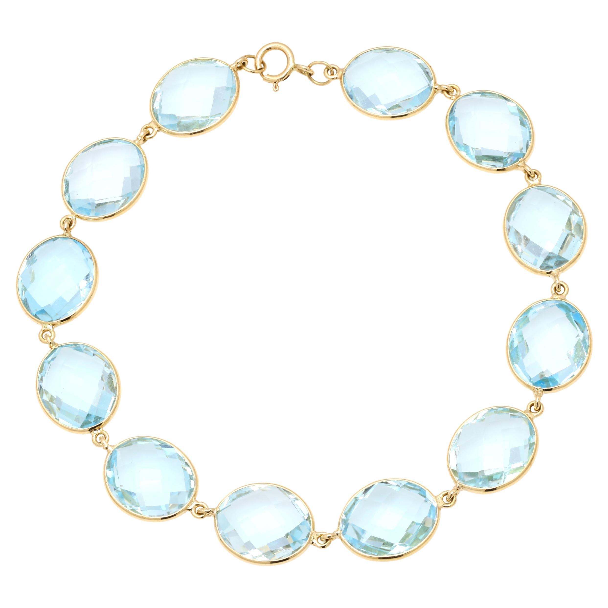 Translucent 41.7 ct Oval Blue Topaz Chain Bracelet in Solid 18K Yellow Gold For Sale