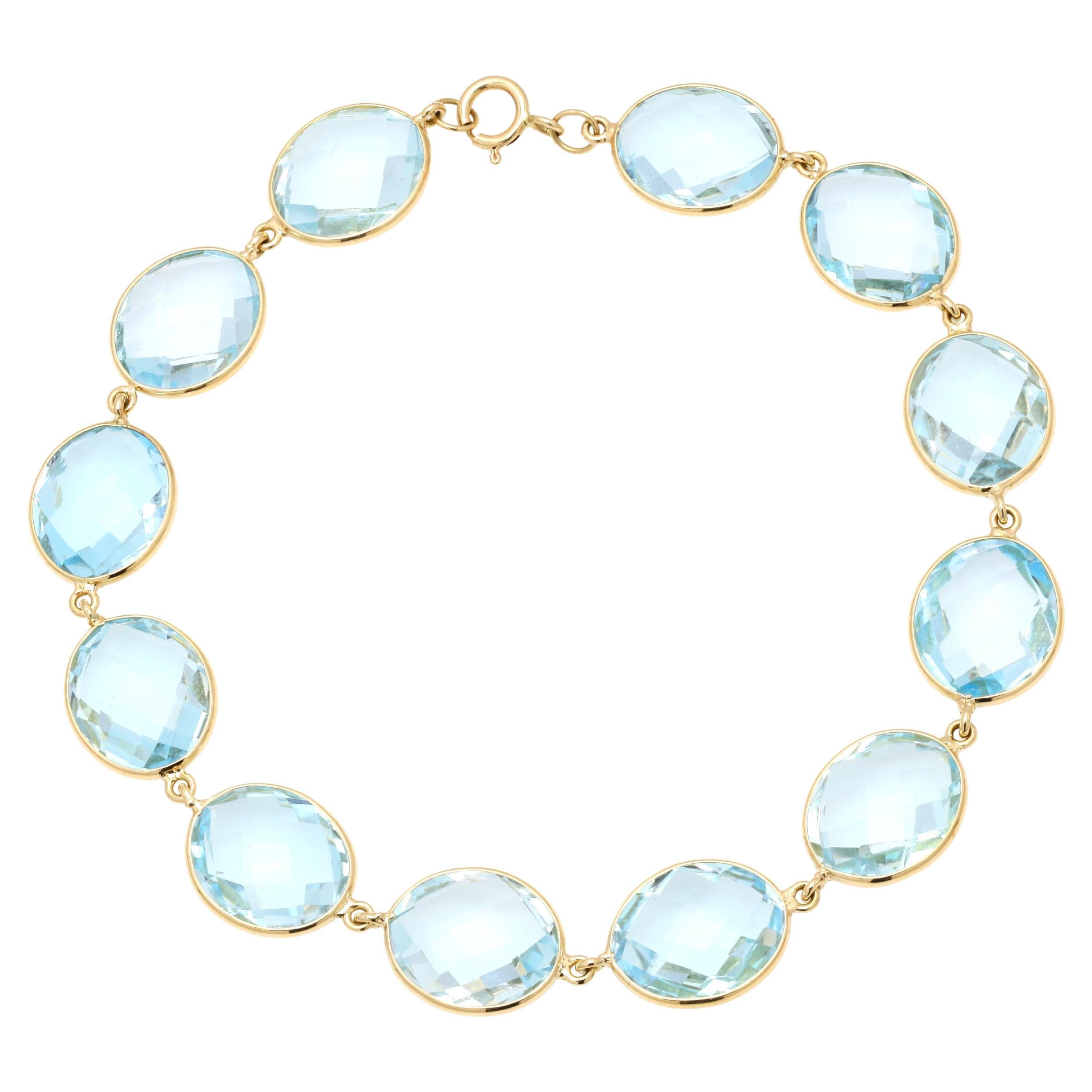 Transluzentes Armband aus massivem 18 Karat Gelbgold mit 41,7 Karat ovalem blauem Topas im Angebot