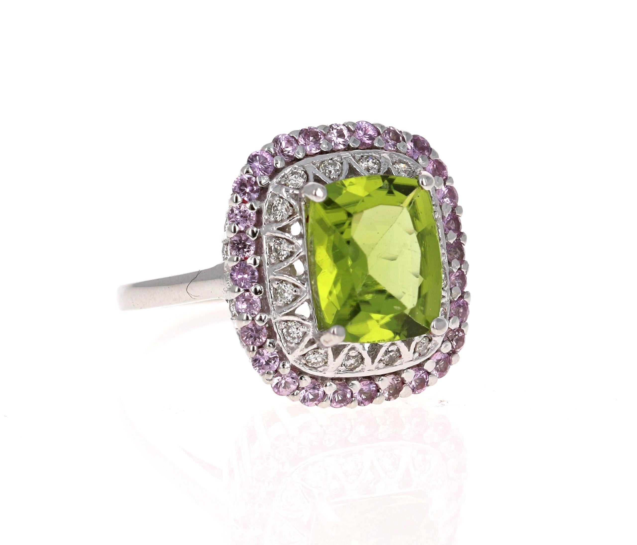 4.18 Carat Cushion Cut Peridot Sapphire and Diamond 14 Karat White Gold Ring

This beautiful ring has an Cushion Cut Peridot that weighs 3.38 Carats. The ring is surrounded by 28 Light Pink Sapphires that weigh 0.63 Carats and 16 Round Cut Diamonds
