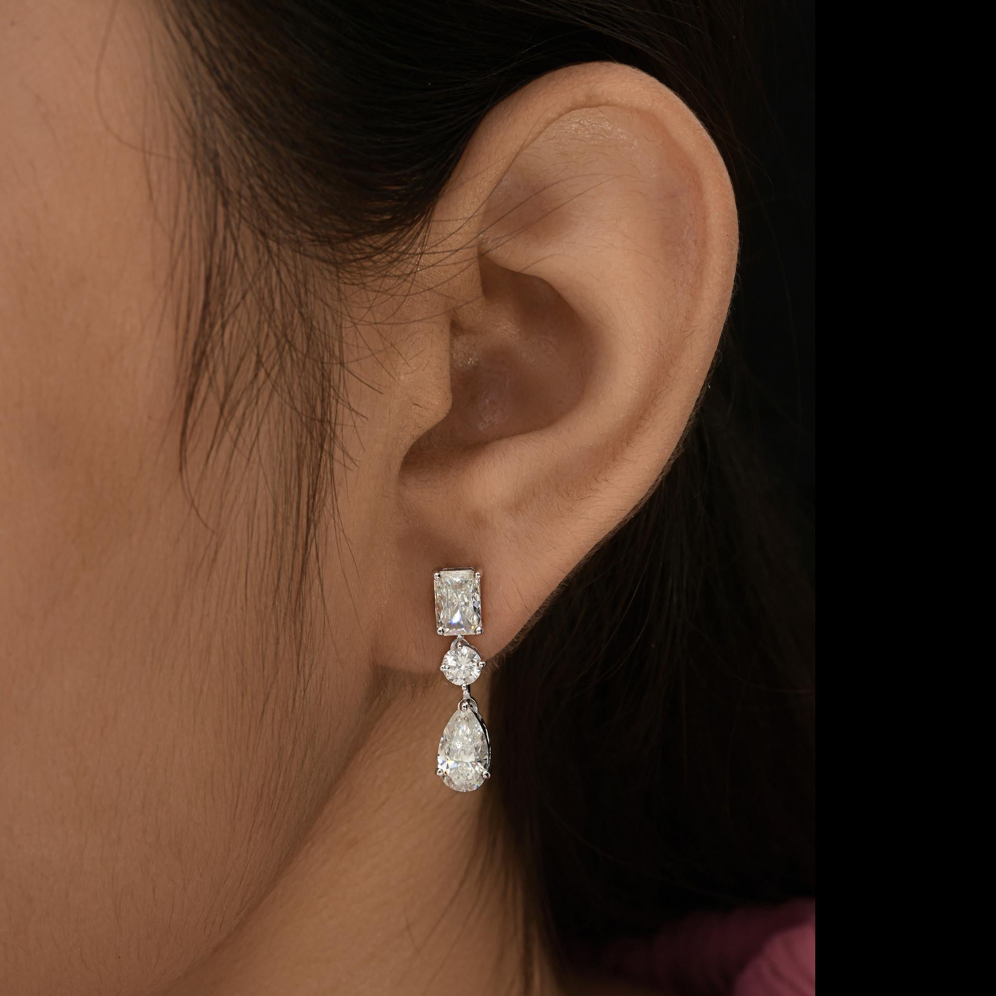 4.18 Carat Mixed Shape Diamond Drop Earrings 14k White Gold All Tariffs Paid
These earrings are masterfully set with a sequence octagon, round and pear cut  diamonds set in a row making a dangling drop earrings. 
Diamonds are a universal symbol of