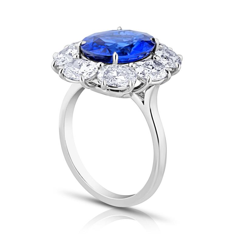 4.18 carat Oval Blue Sapphire with eight Oval Brilliant Diamonds 2.68 carats set in a handmade Platinum ring.