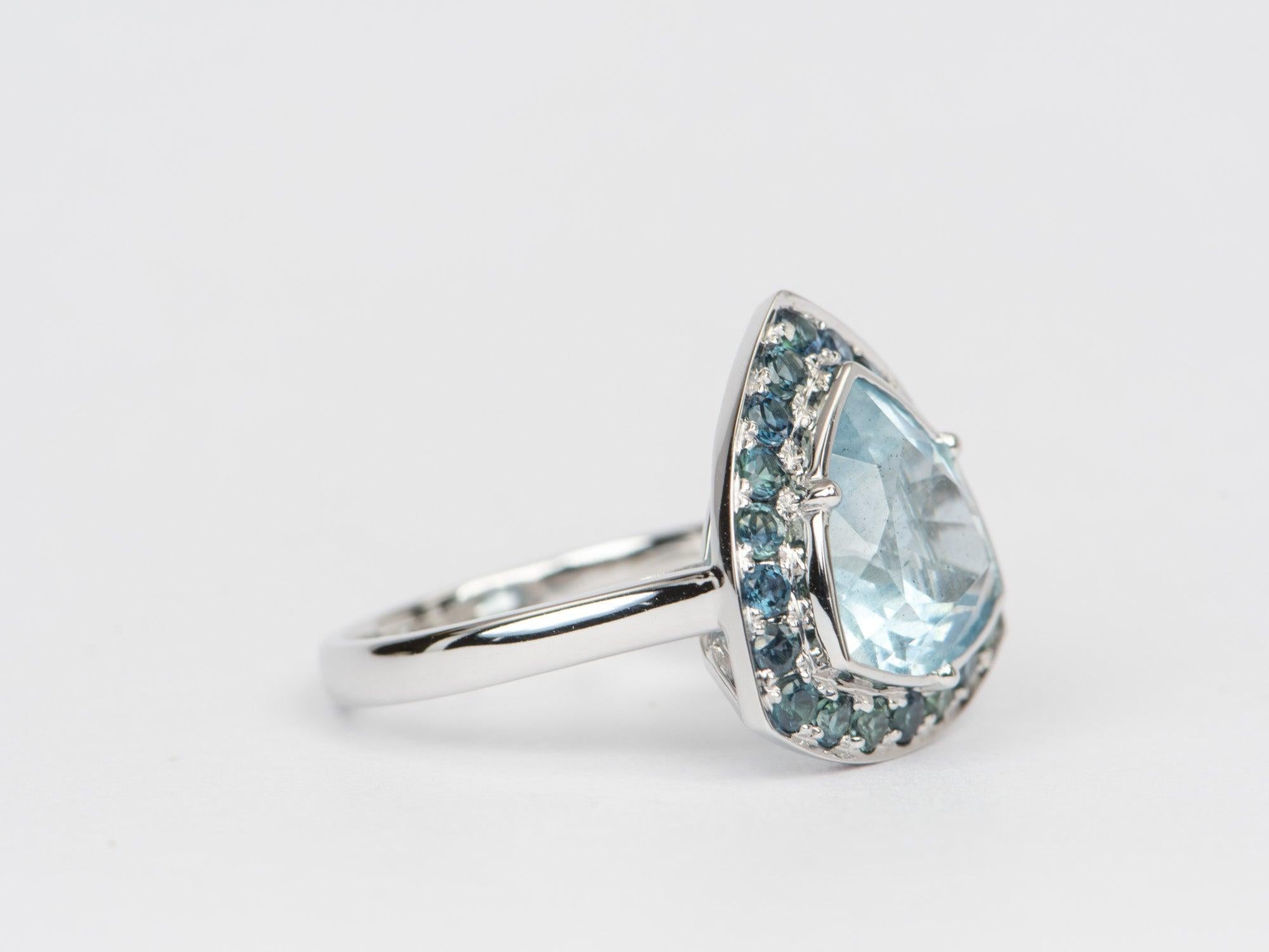 ♥ Solid 9k white gold ring set with a beautiful trillion-shaped moss aquamarine with a Montana sapphire halo
♥ Gorgeous blue color!
♥ The item measures 18.4mm in length, 17.7mm in width, and stands 8mm from the finger

♥ US Size 8 (Free resizing up