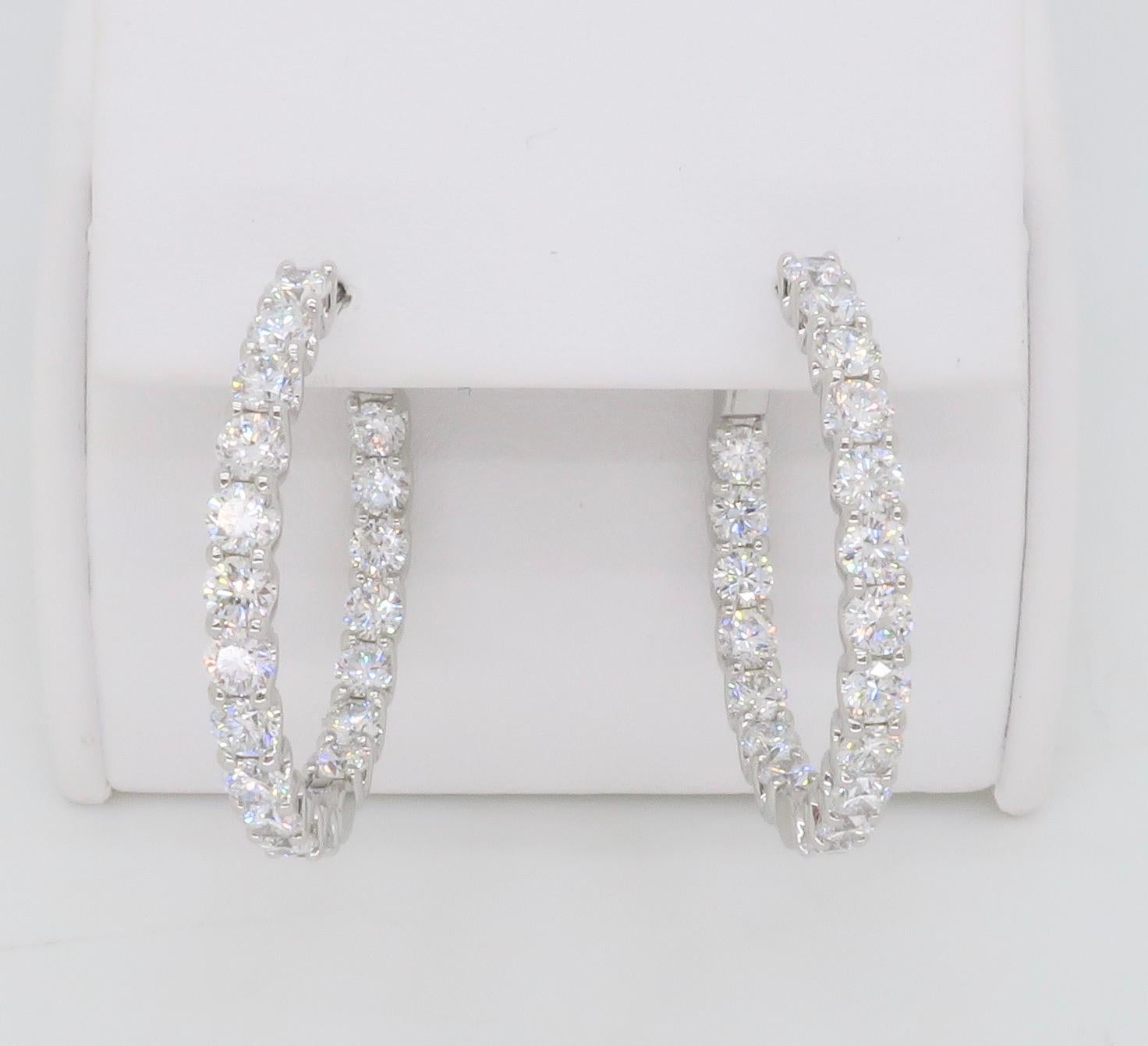 Stunning 4.18ctw Diamond inside out hoop earrings made in 14k white gold, featuring a lock style closure for extra security. 

Diamond Carat Weight: 4.18 CTW 
Diamond Cut: Round Brilliant 
Color: Average F-G
Clarity: Average VS
Metal: 14K White