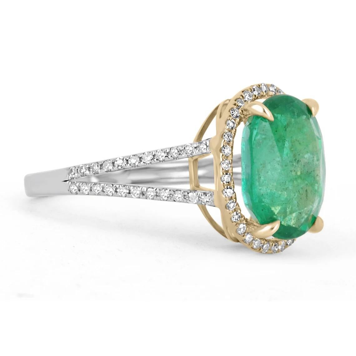 This is an exquisite, natural emerald and diamond halo split shank ring. The gorgeous setting lets sit an excellent quality emerald with beautiful color and very good eye clarity. The emerald is not perfect and small imperfections do exist as it is