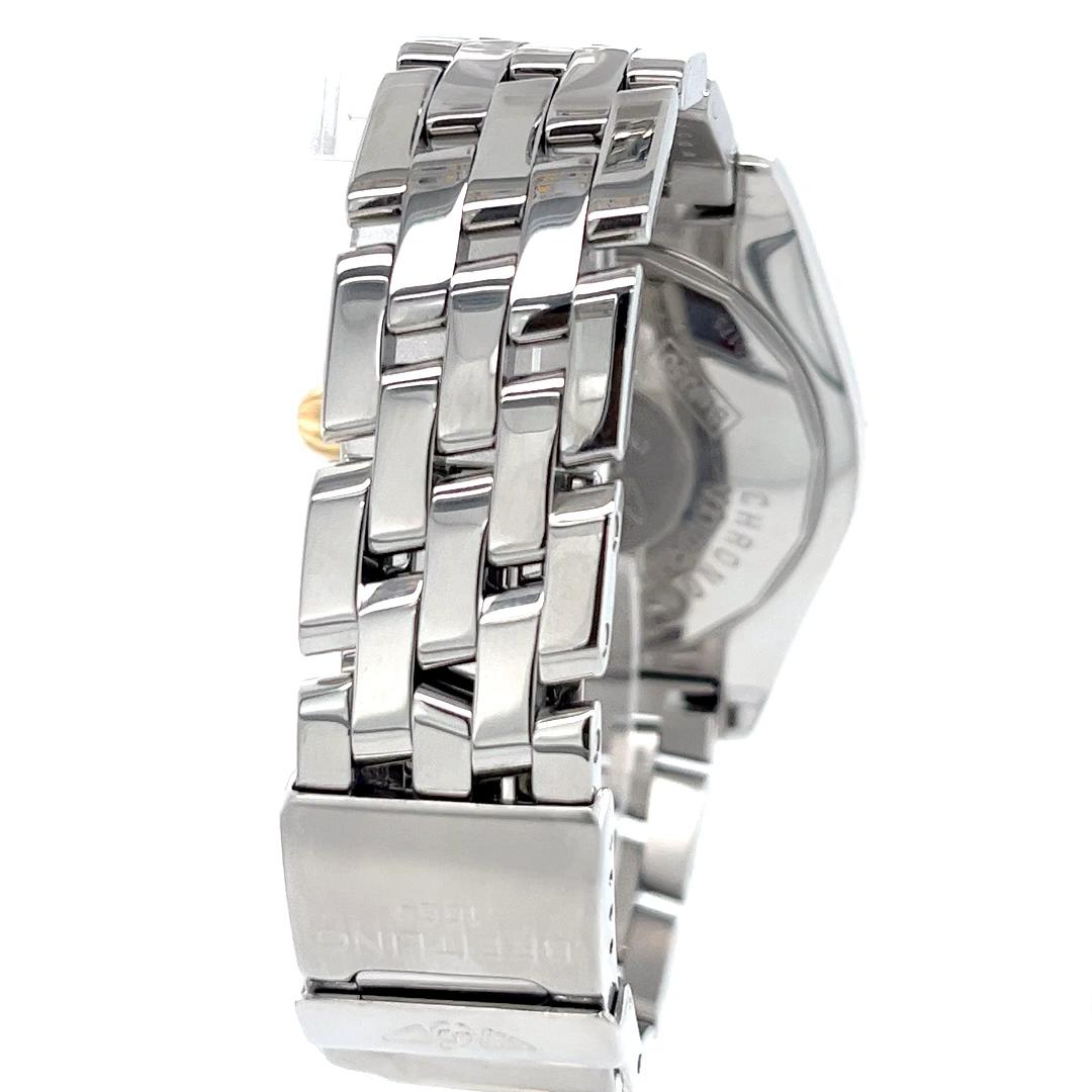Cette Breitling Cockpit d'occasion est un chronomètre automatique de 41 mm qui allie mécanique de précision et design de luxe. Réalisée en acier inoxydable et rehaussée d'or jaune 18 carats, la montre présente une lunette unidirectionnelle en or et
