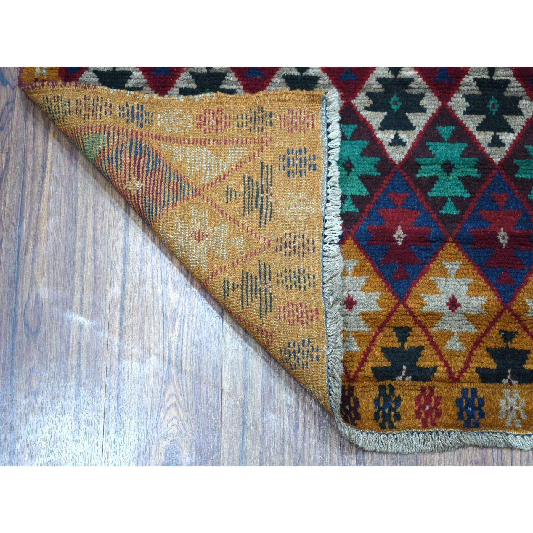 This is a truly genuine one-of-a-kind Brown Tribal Design Colorful Afghan Baluch Hand Knotted Pure Wool Oriental Rug. It has been woven for months and months in the centuries-old Persian weaving craftsmanship techniques by expert artisans.
Primary