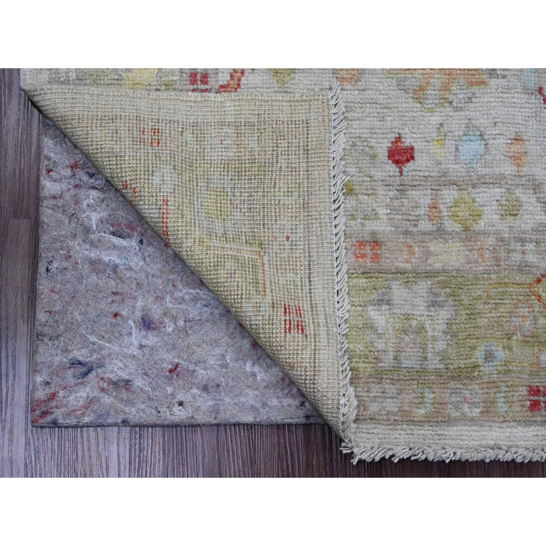 Oyster Gray, Afghan Angora Oushak with All Over Leaf Design, Vegetable Dyes, Hand Knotted, 100% Wool, Oriental Rug
Primary materials: Wool
Latex: No Pile 
height: 0.25 Inches
Style: Transitional
Primary color: Grey
Secondary colors: Red, Orange,