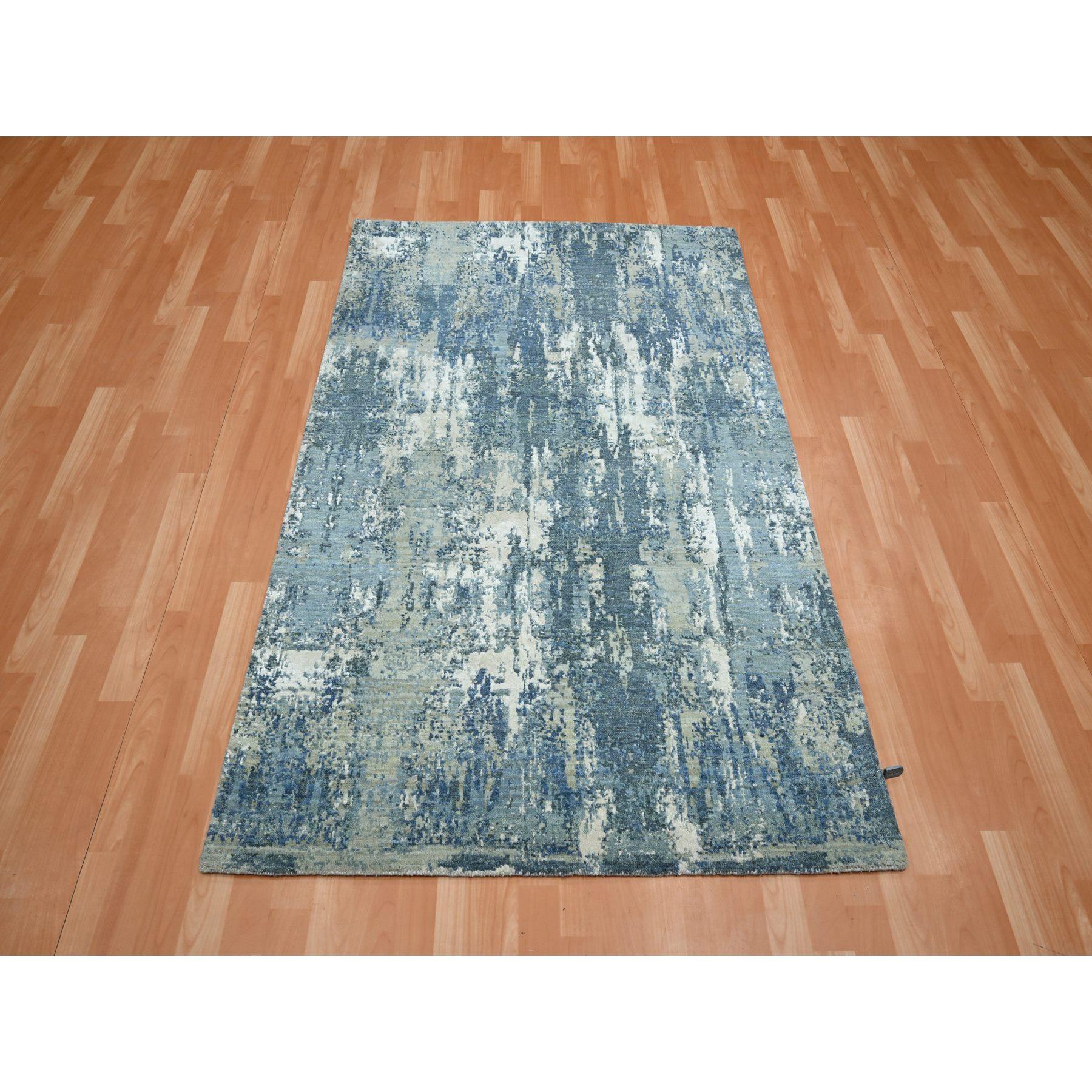 Sapphire Blue, Hand Knotted, Abstract Design, Denser Weave, Hi-Low Pile, Wool and Real Silk, Oriental Rug
Primary materials: Wool & Silk
Latex: No Pile 
height: 0.25 Inches
Style: Contemporary
Primary color: Blue
Secondary colors: Ivory, Teal,