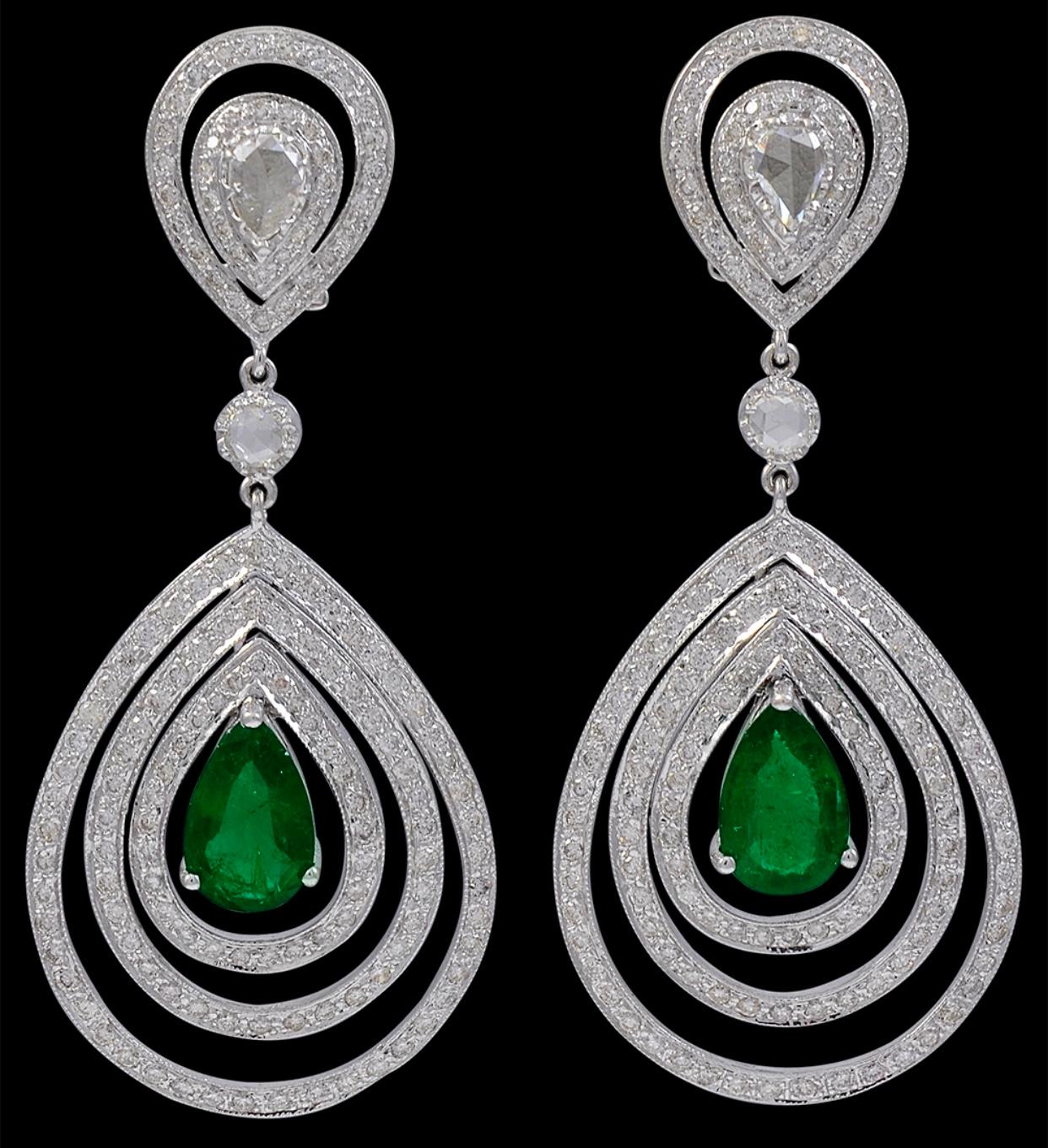 GIA Certified 4.2Ct Zambian Pear Emerald Diamond Hanging/ Drop Earrings 18K Gold
Approximately 4.2 Carat Zambian Pear Shape Emerald Diamond  Hanging Earrings 18 Karat  White Gold
This exquisite pair of earrings are beautifully crafted with 18 karat