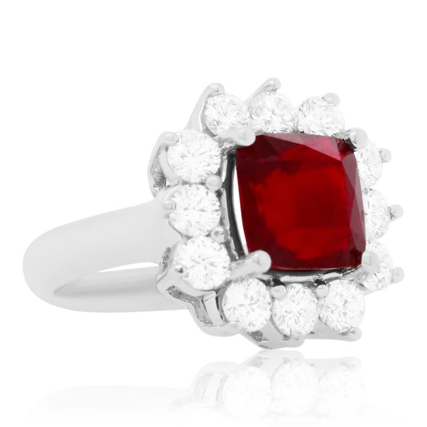 Material: 18K White Gold
Gemstone Details: 1 Cushion Ruby at 4.2 Carats- Measuring 8.5 x 8.5 mm 
Diamond Details: 12 Brilliant Round White Diamonds at 1.60 Carats. SI Clarity / H-I Color. 
Ring Size: 6.75. Alberto offers complimentary sizing on all