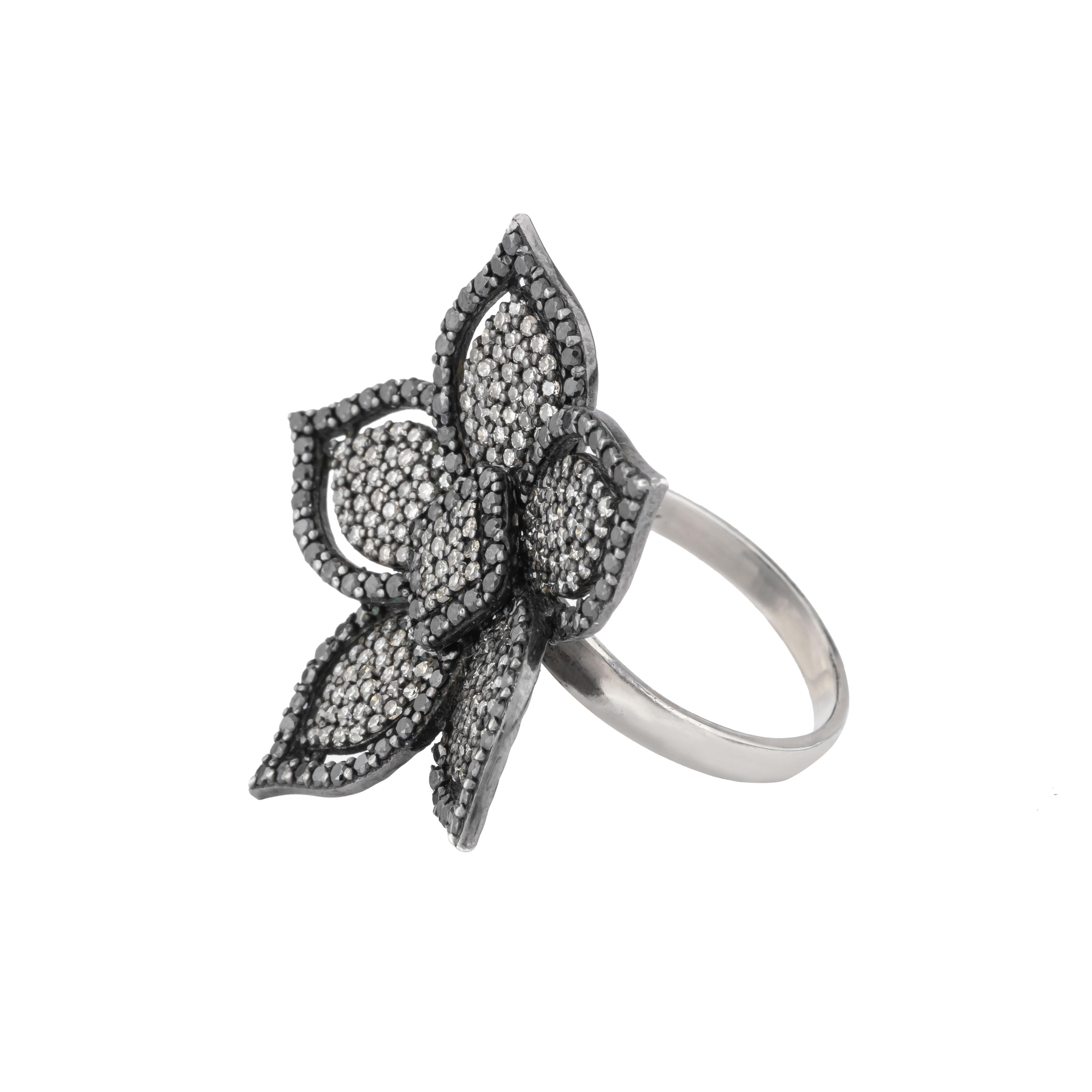 Unveil the epitome of floral elegance with this 4.2 Carat Diamond Flower Cocktail Ring. Exquisitely designed, the ring showcases a radiant blossom, meticulously crafted with brilliant-cut diamonds. Each petal gleams with a flawless array of
