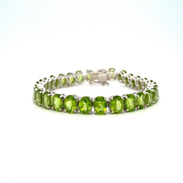 Oval Cut 42 Carat Green Peridot August Birthstone Tennis Bracelet in 925 Silver for Women For Sale