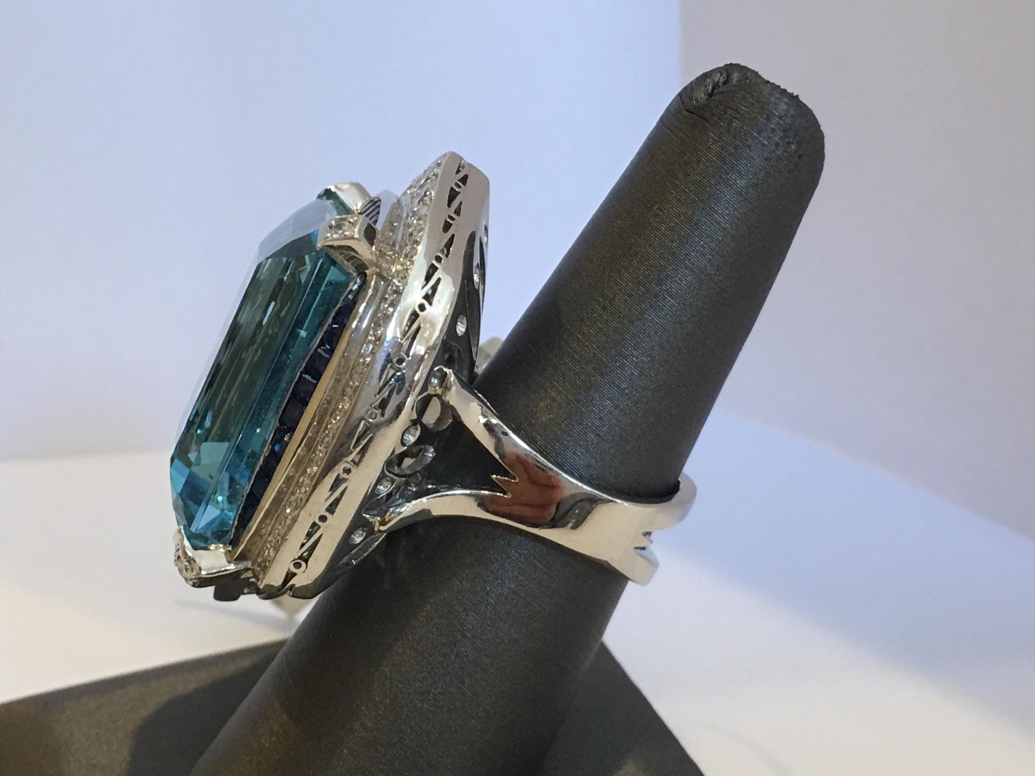 42 Natural Aquamarine with approx 6 Carat sapphire and diamonds set in Platinum.

The Ring is from deco period.

This is previously owned but has no sign of wear and tear.