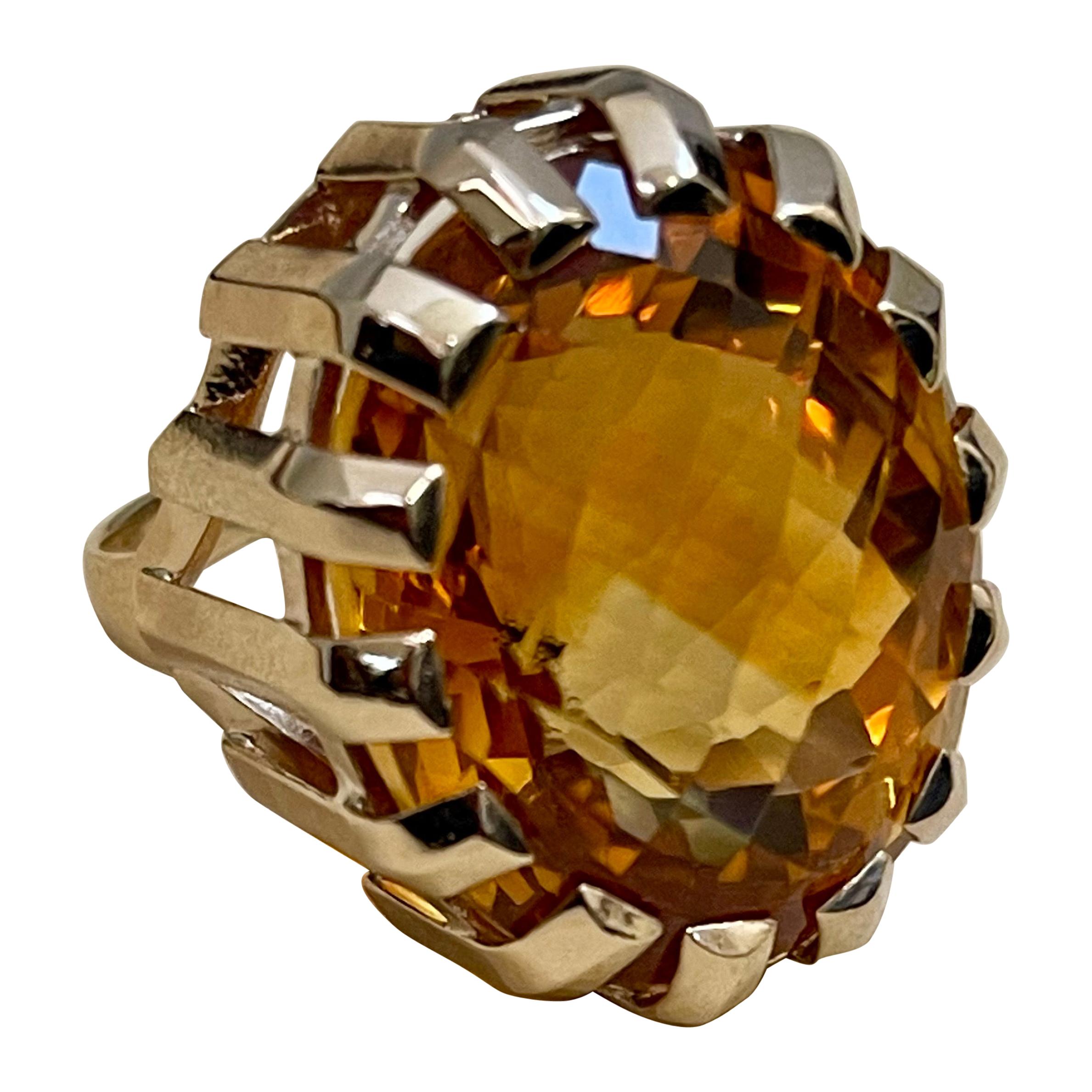 Approximately 42 Carat Natural Oval Citrine Cocktail  Ring in 14 Karat Yellow Gold, Estate 

This is a ring which has a  approximately 42 carat of high quality Citrine stone. The stone is 23.5 X 20 MM and 16 mm Deep
Color and clarity is very nice.
