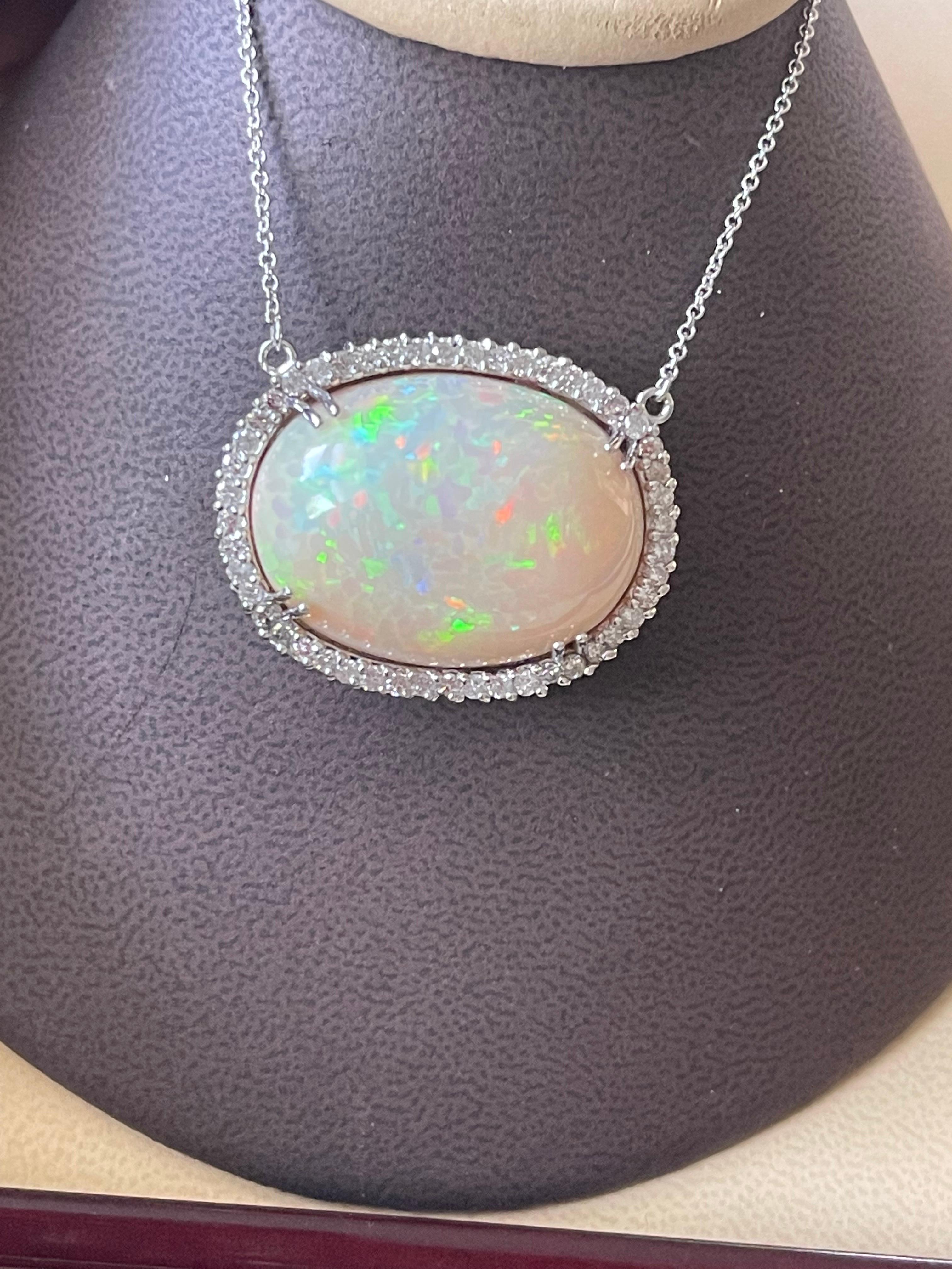 Oval Cut 42 Carat Oval Ethiopian Opal & Diamond Pendant 14 Karat White Gold Necklace For Sale
