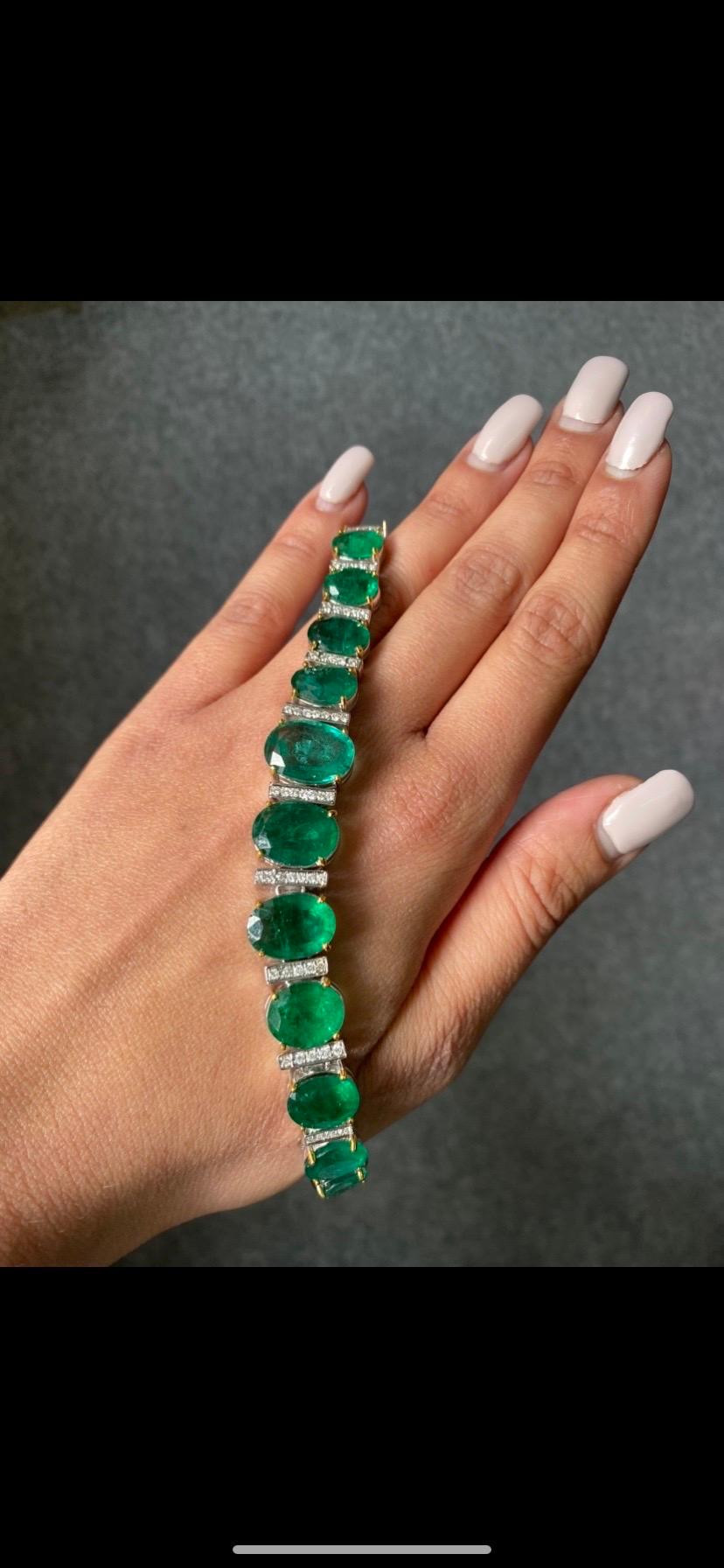 A statement 42 carat, oval shaped Zambian Emerald and Diamond Bracelet set in solid 18K White Gold. All natural Emeralds, with a great vivid green color - and great luster.
The bracelet is currently 6.5 inches long, can be resized. 
Please message